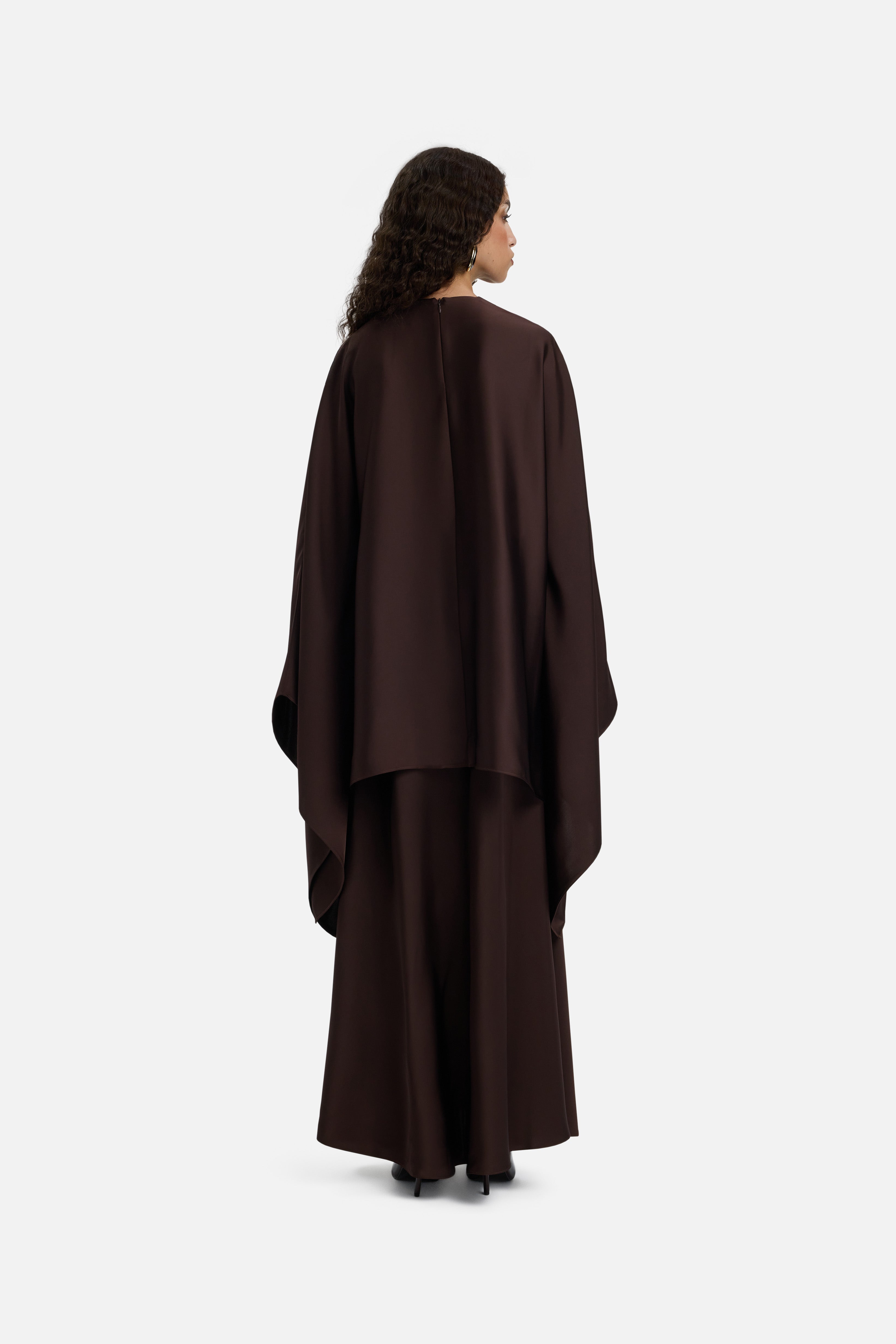 Back view model wearing asymmetric dark brown blouse