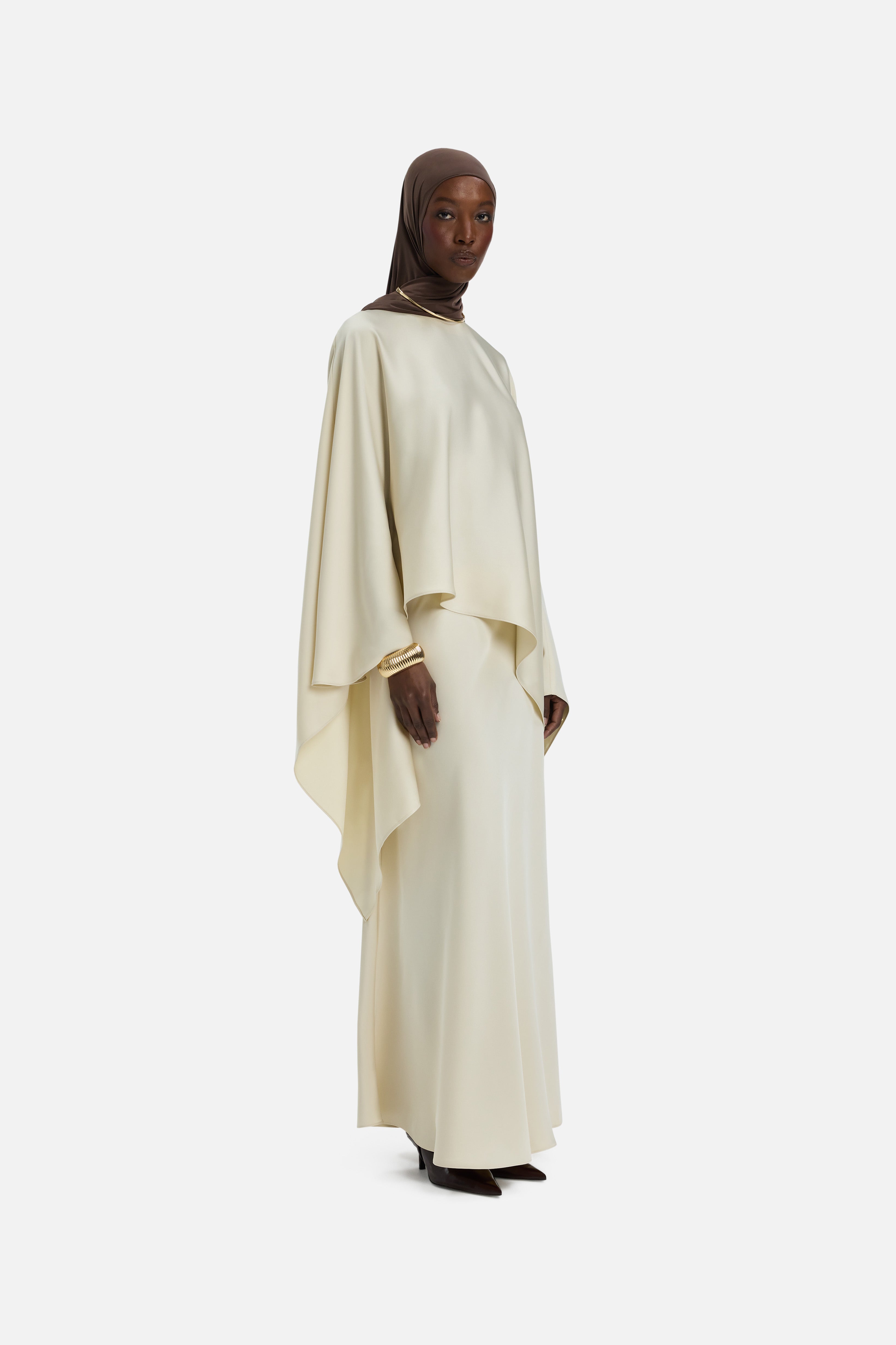 Side view model wearing off white blouse