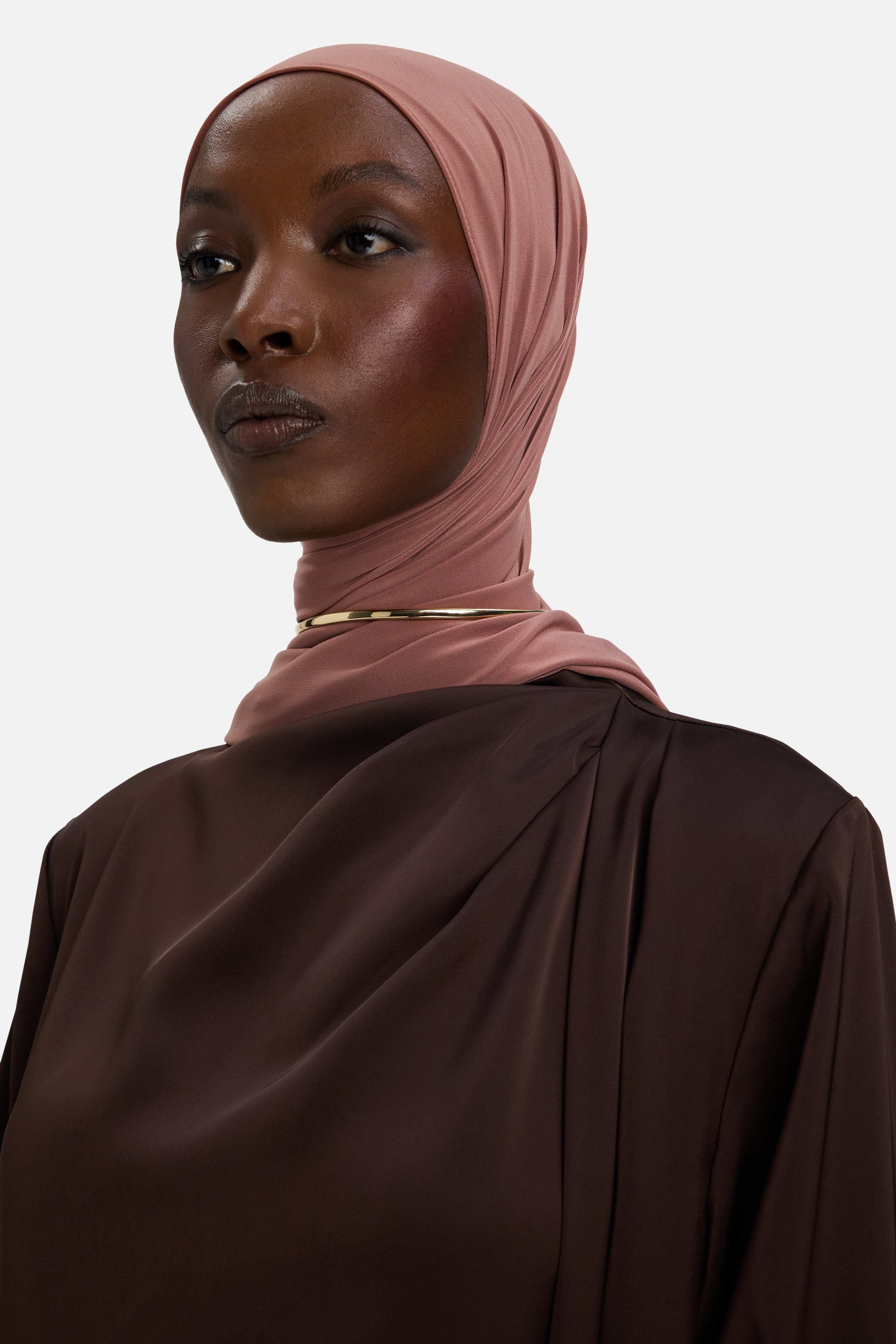 Detail shot draping on dark brown dress