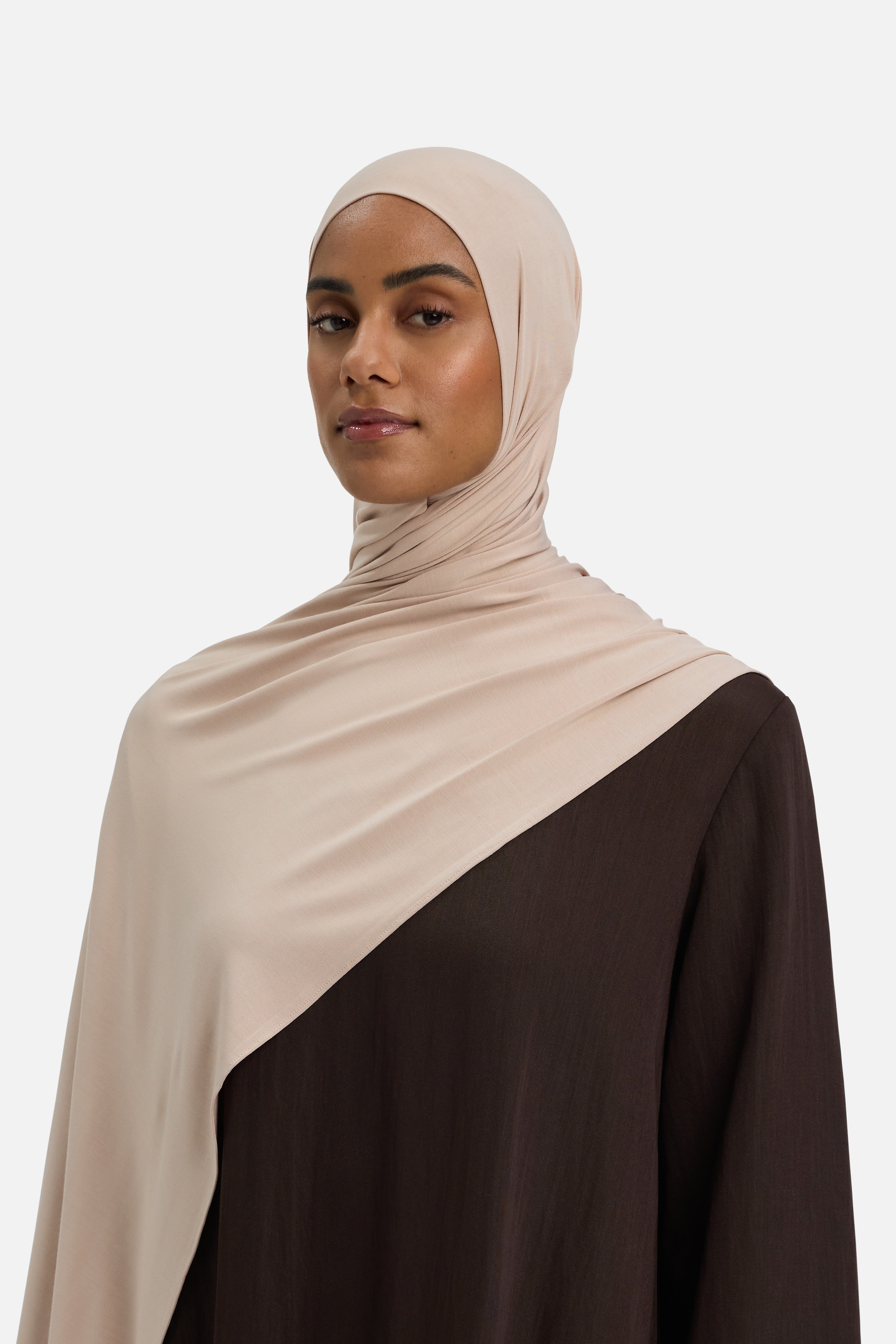 Model wearing beige MERRACHI headscarf, front view
