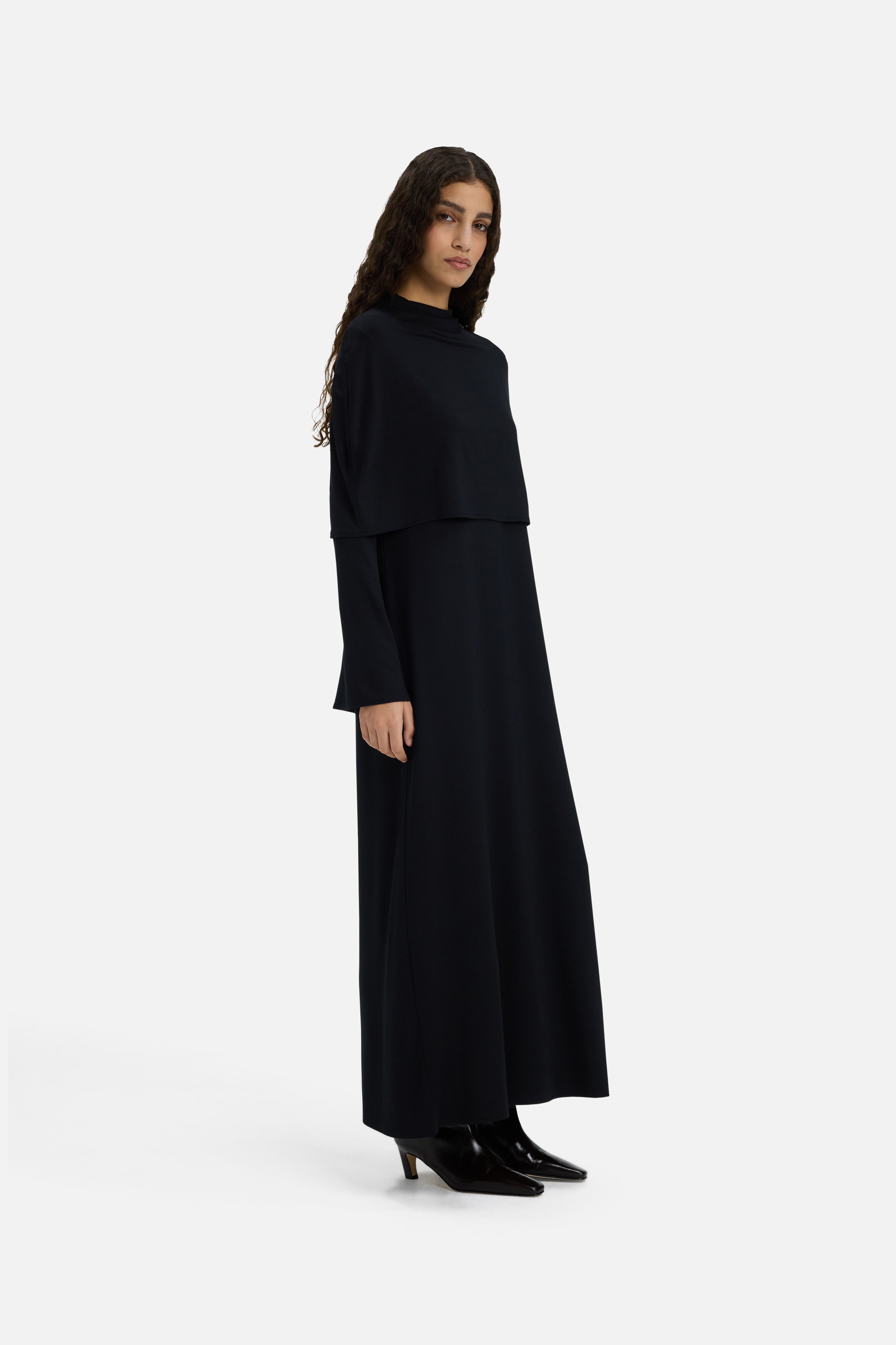 Side view model wearing black dress