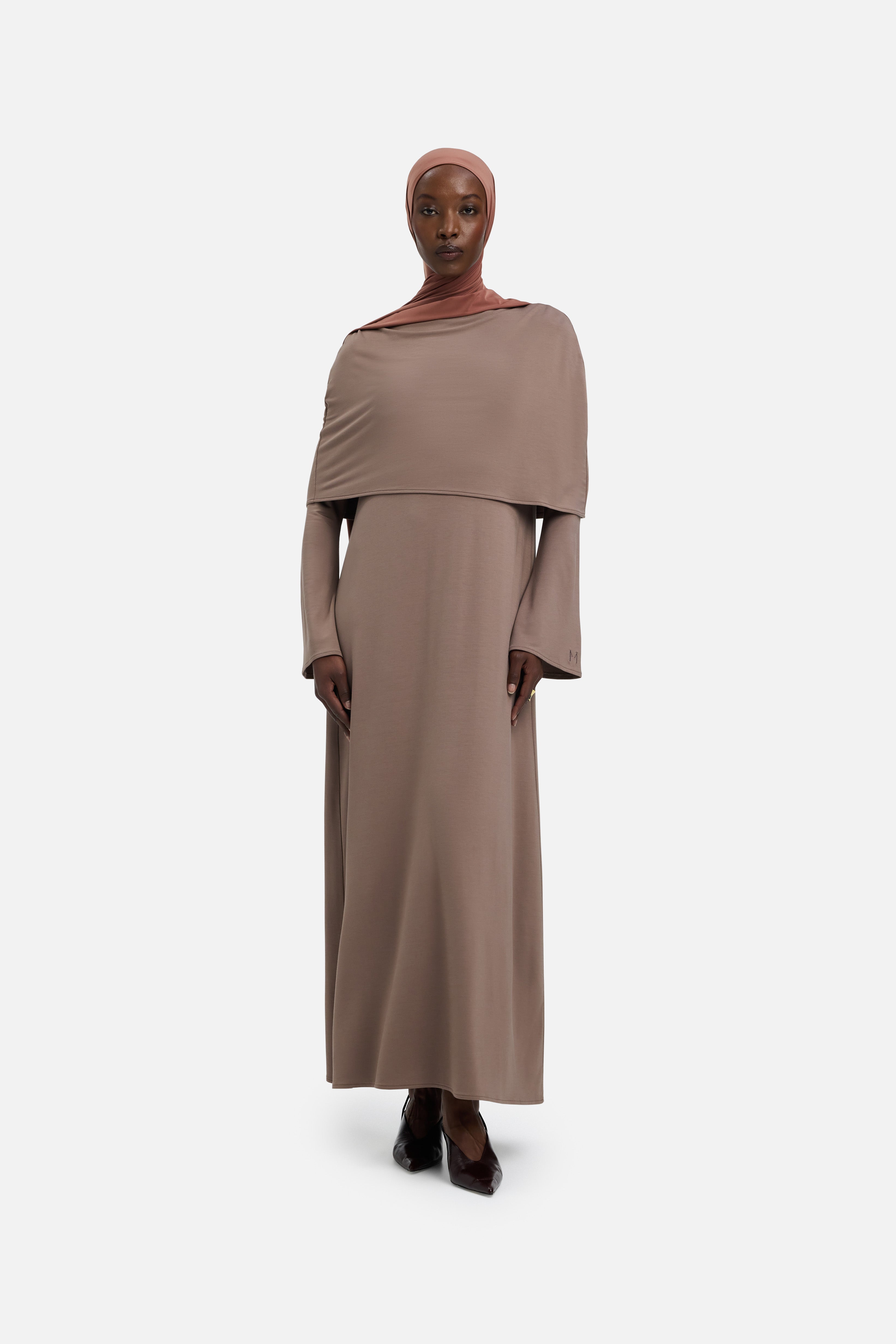 Front view model wearing taupe dress