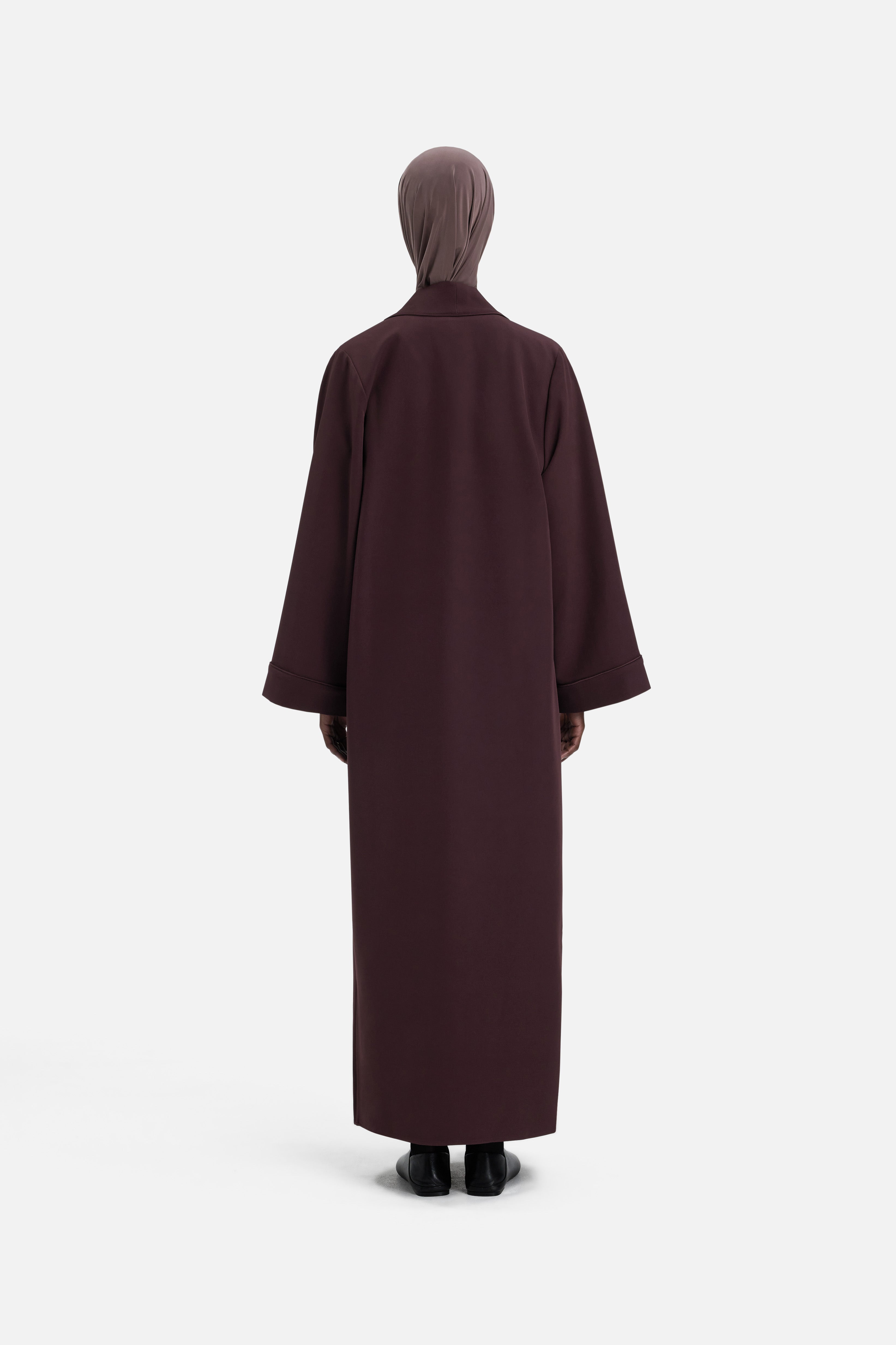 Back view model wearing purple abaya