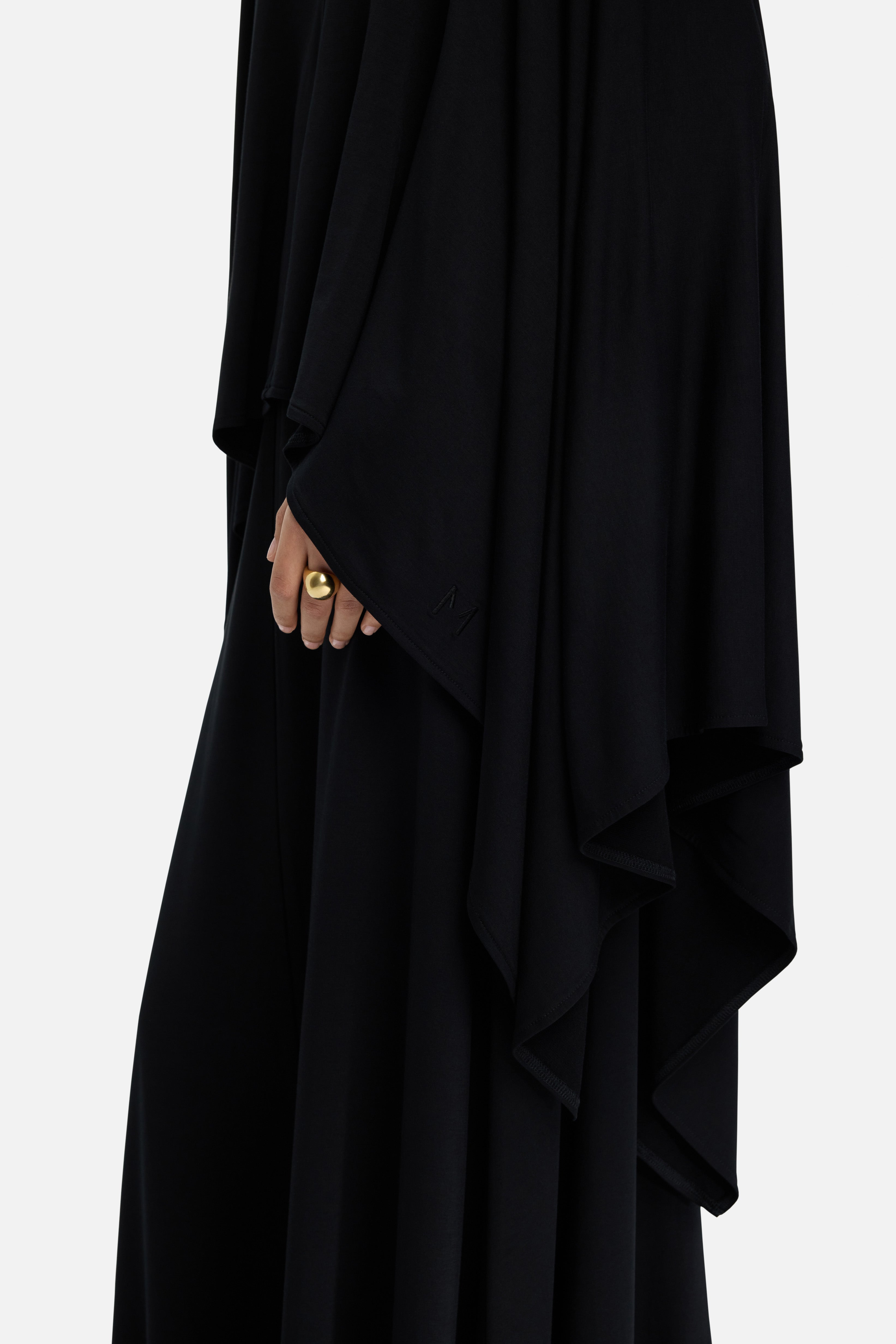 Detail shot black MERRACHI cape