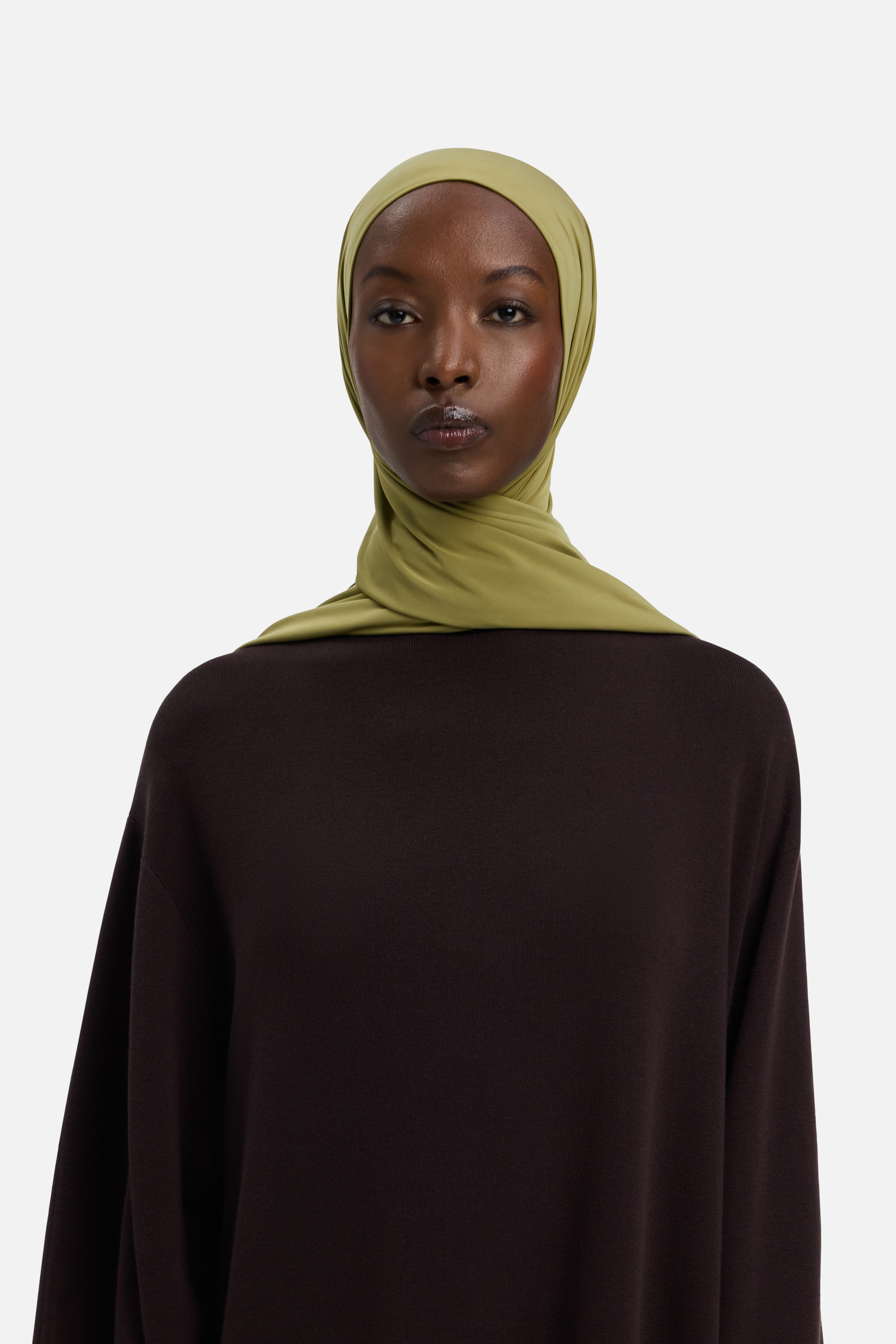 Model wearing green MERRACHI headscarf, front view