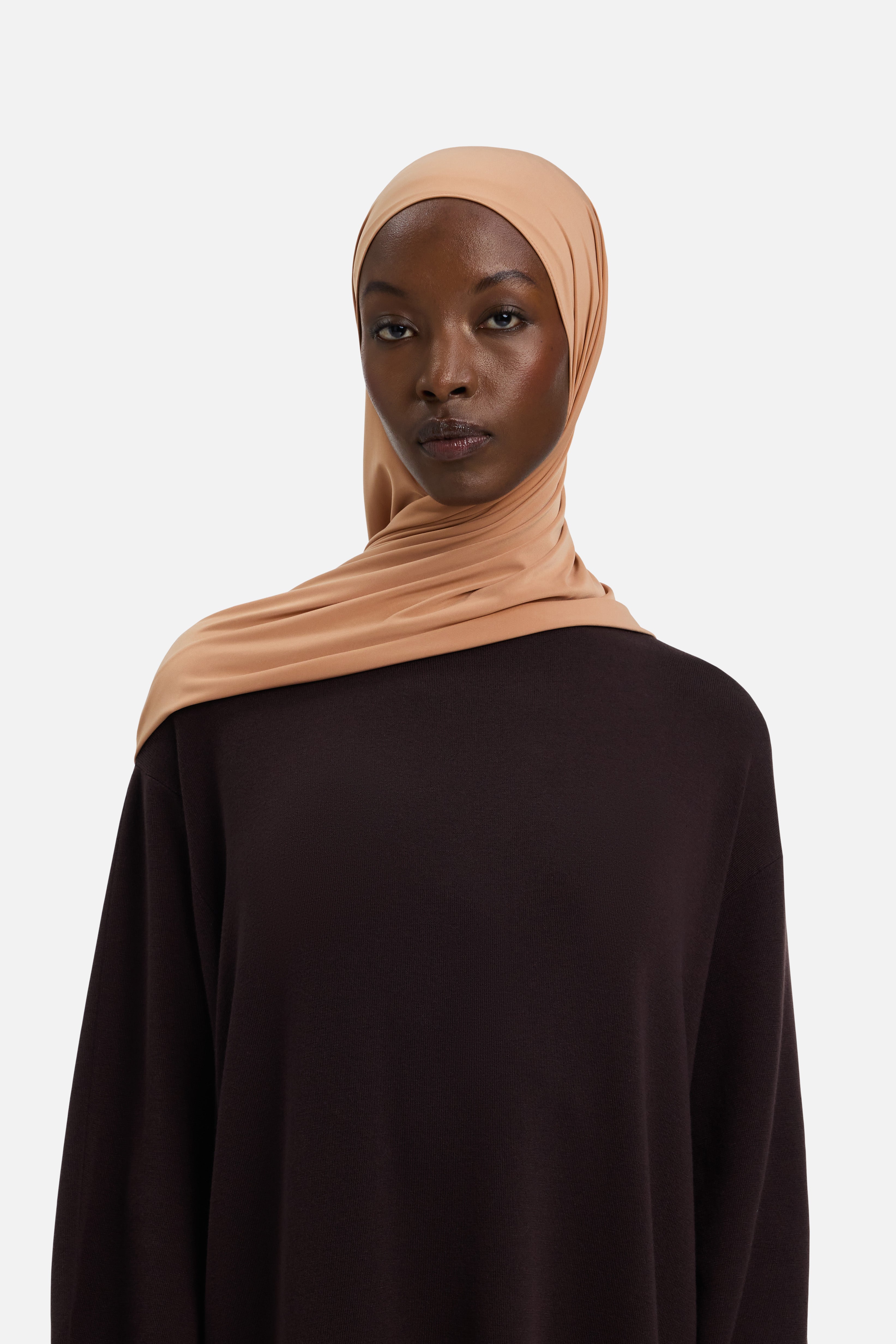 Model wearing orange MERRACHI headscarf, front view