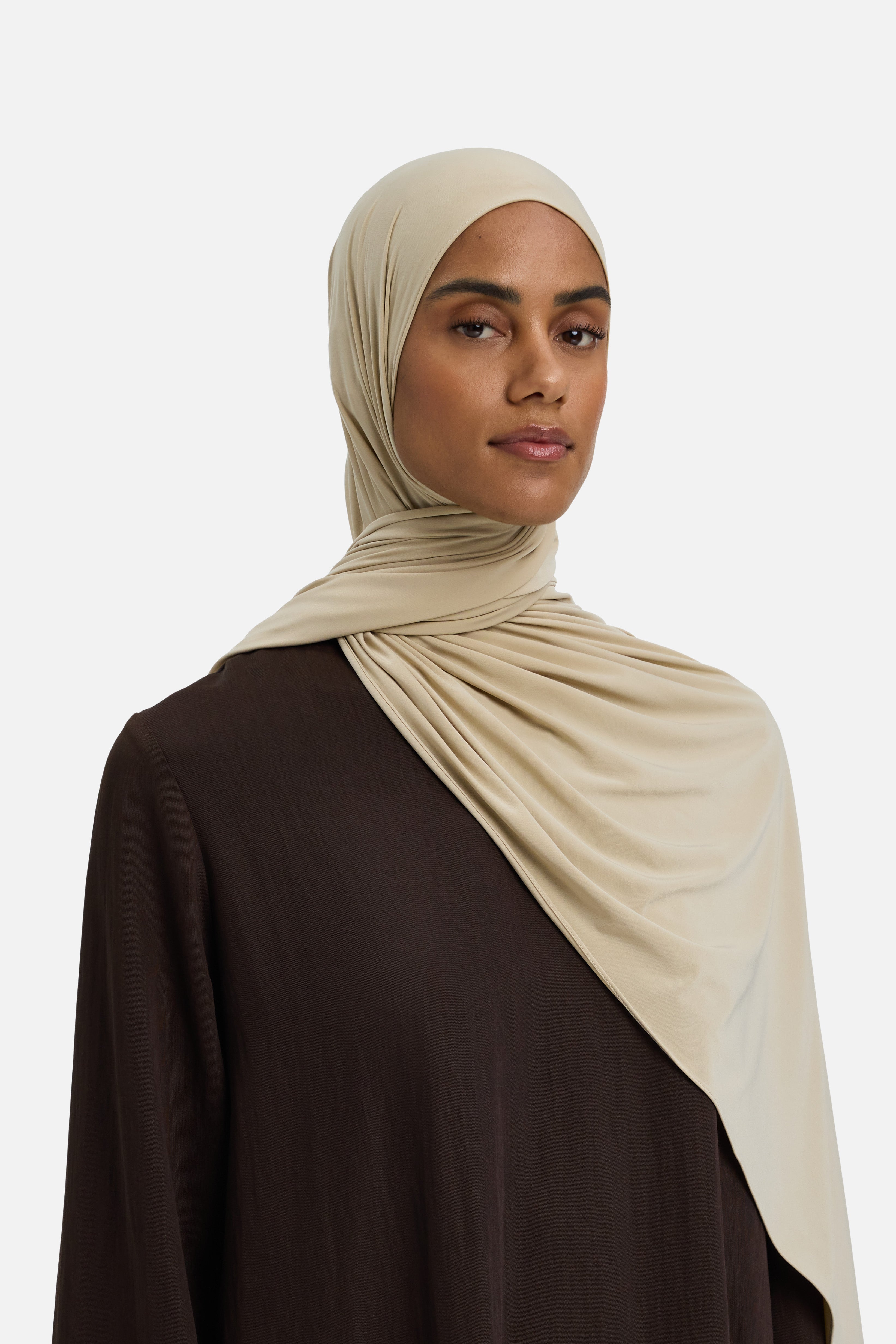 Model wearing beige MERRACHI headscarf, side view