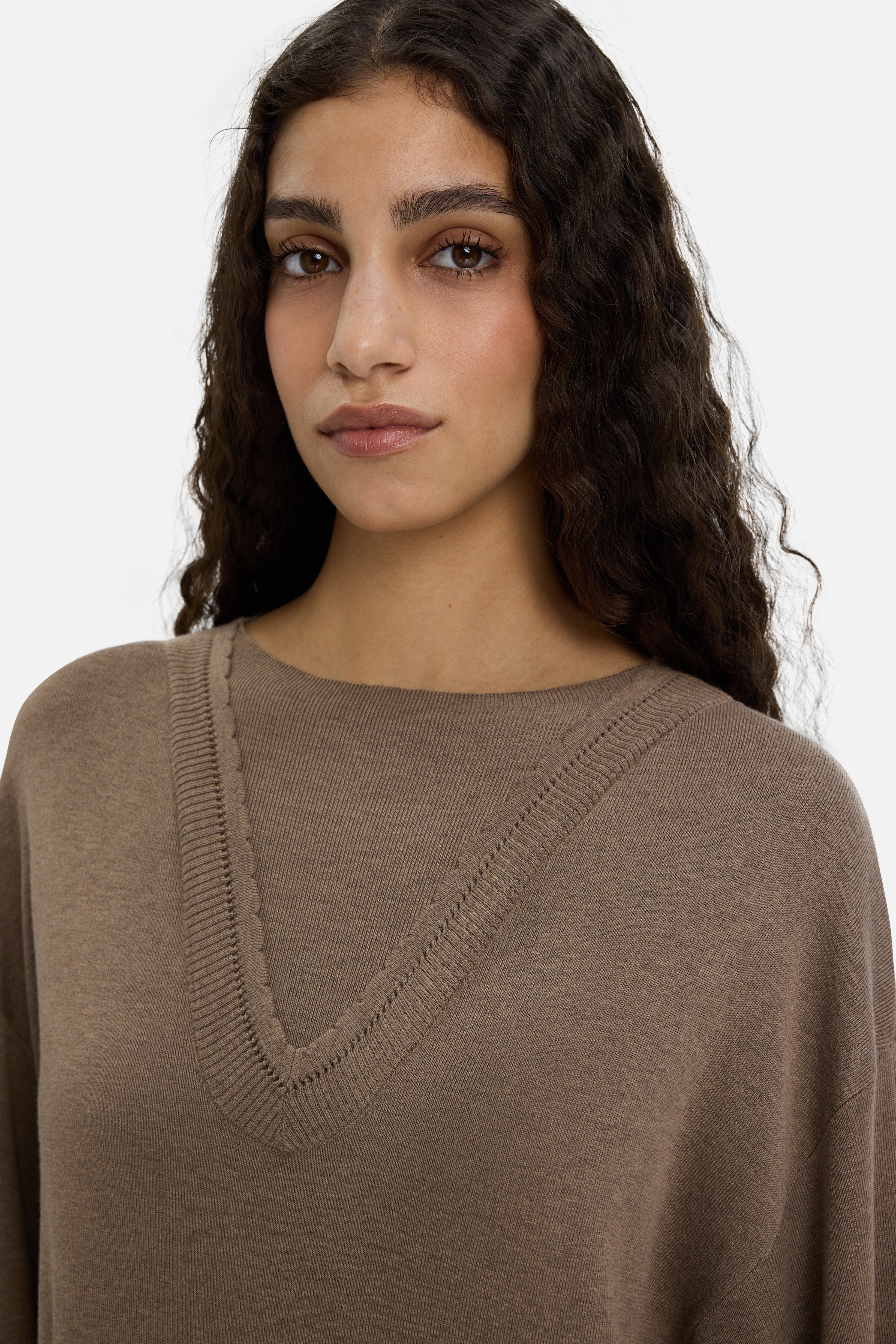 Close up model wearing brown knitted dress