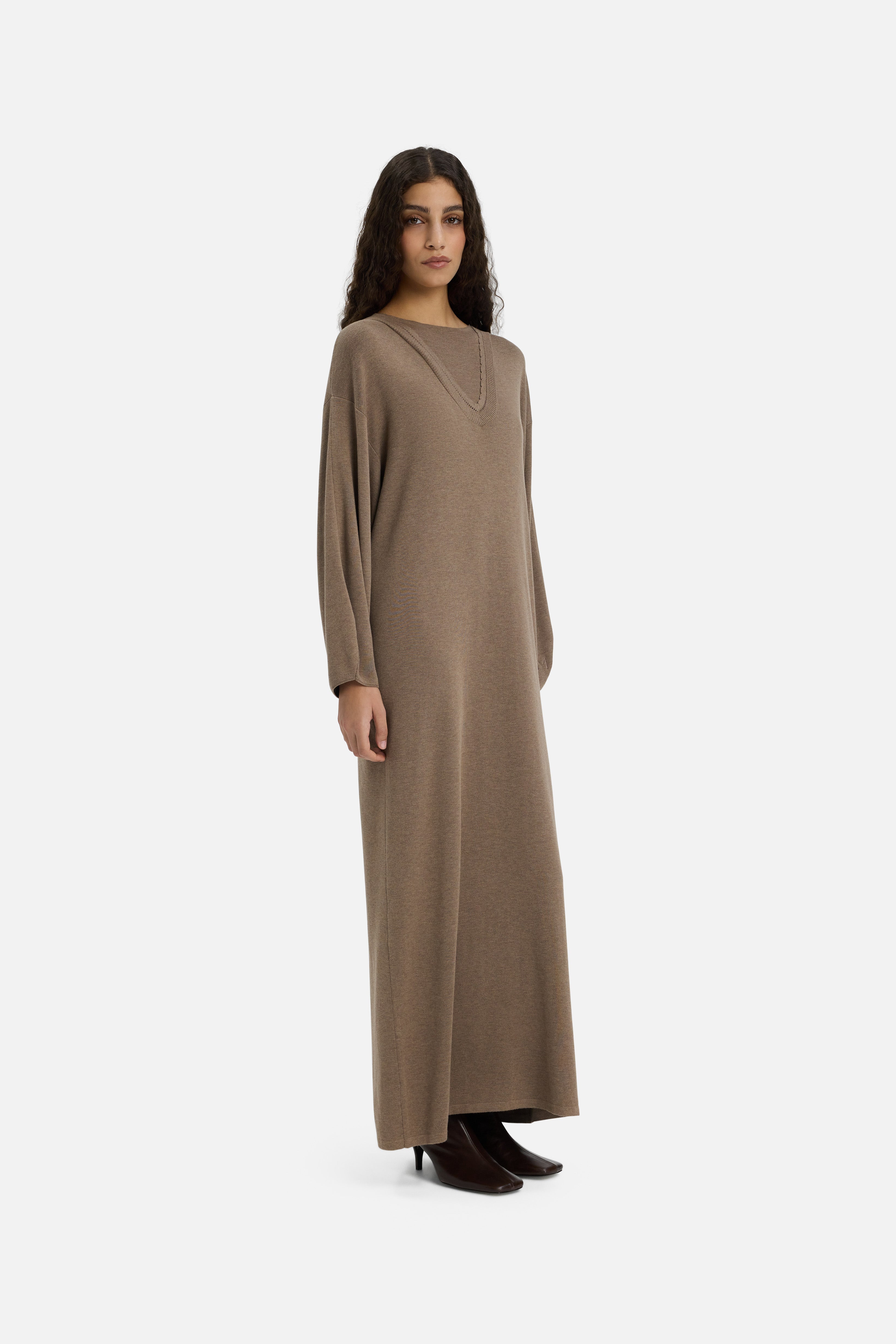 Side view model wearing long brown dress