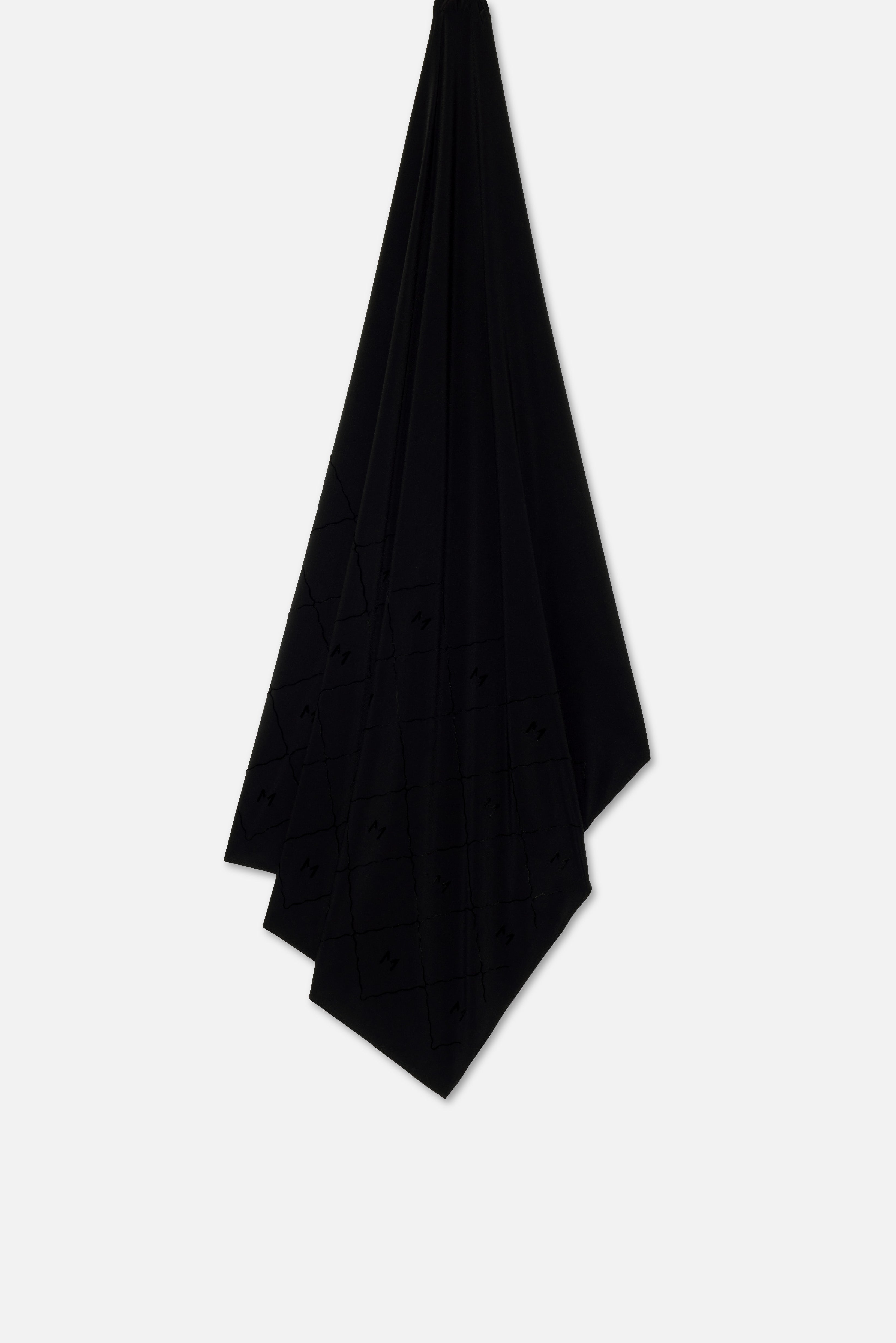 Flat lay black headscarf with MERRACHI logo and embroidery