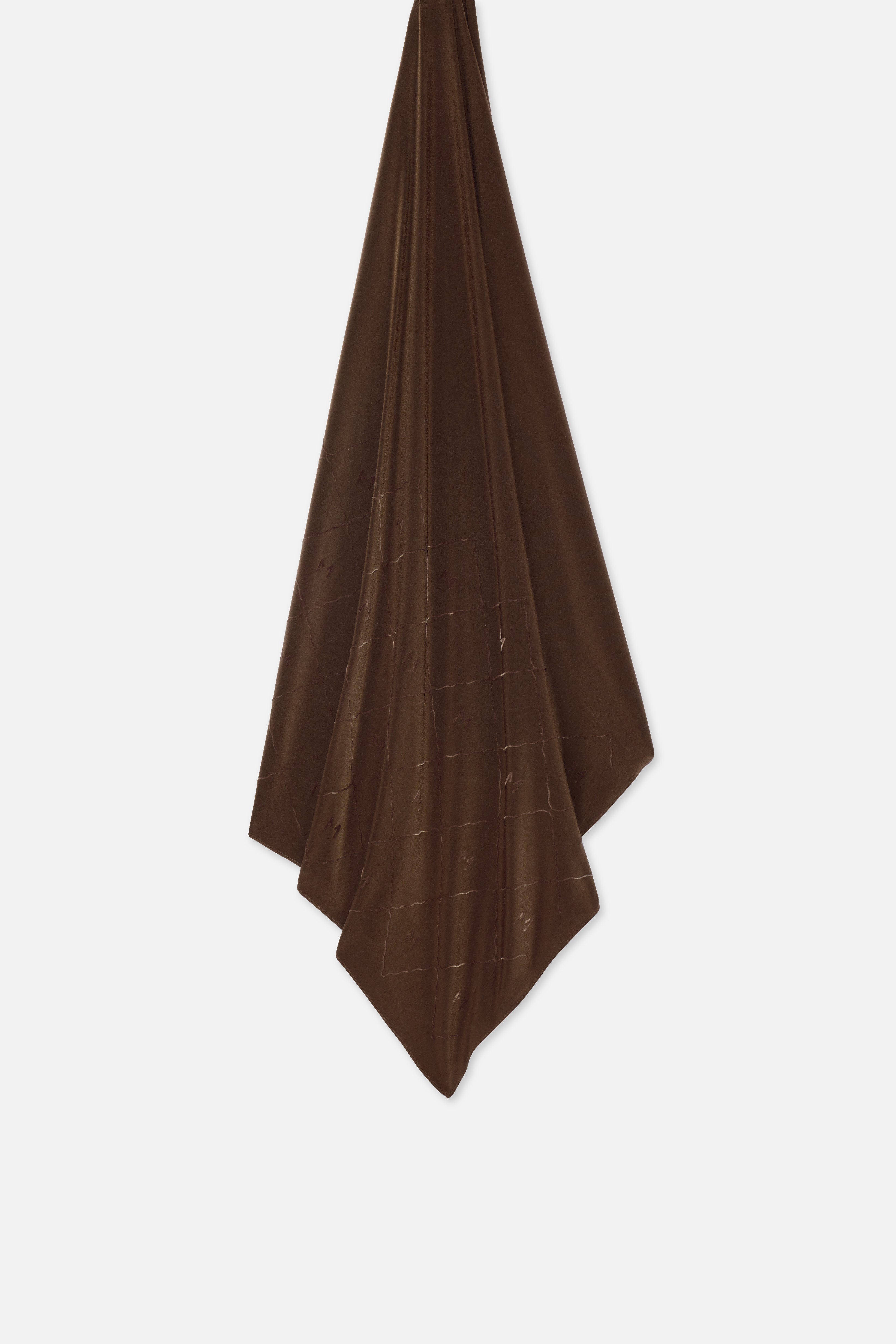 Flat lay dark brown headscarf with MERRACHI logo and embroidery
