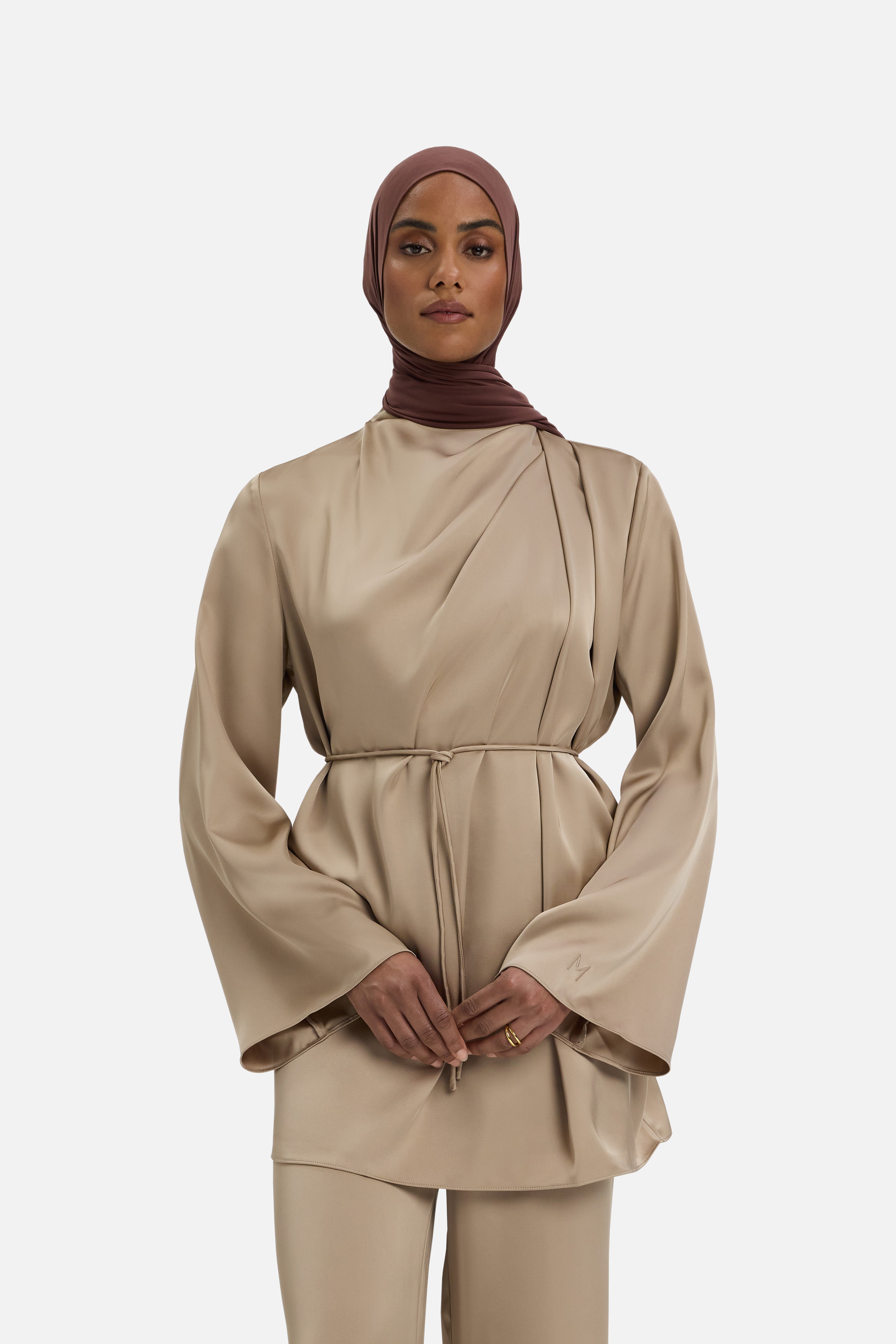 Cropped front view model wearing mocha colored blouse