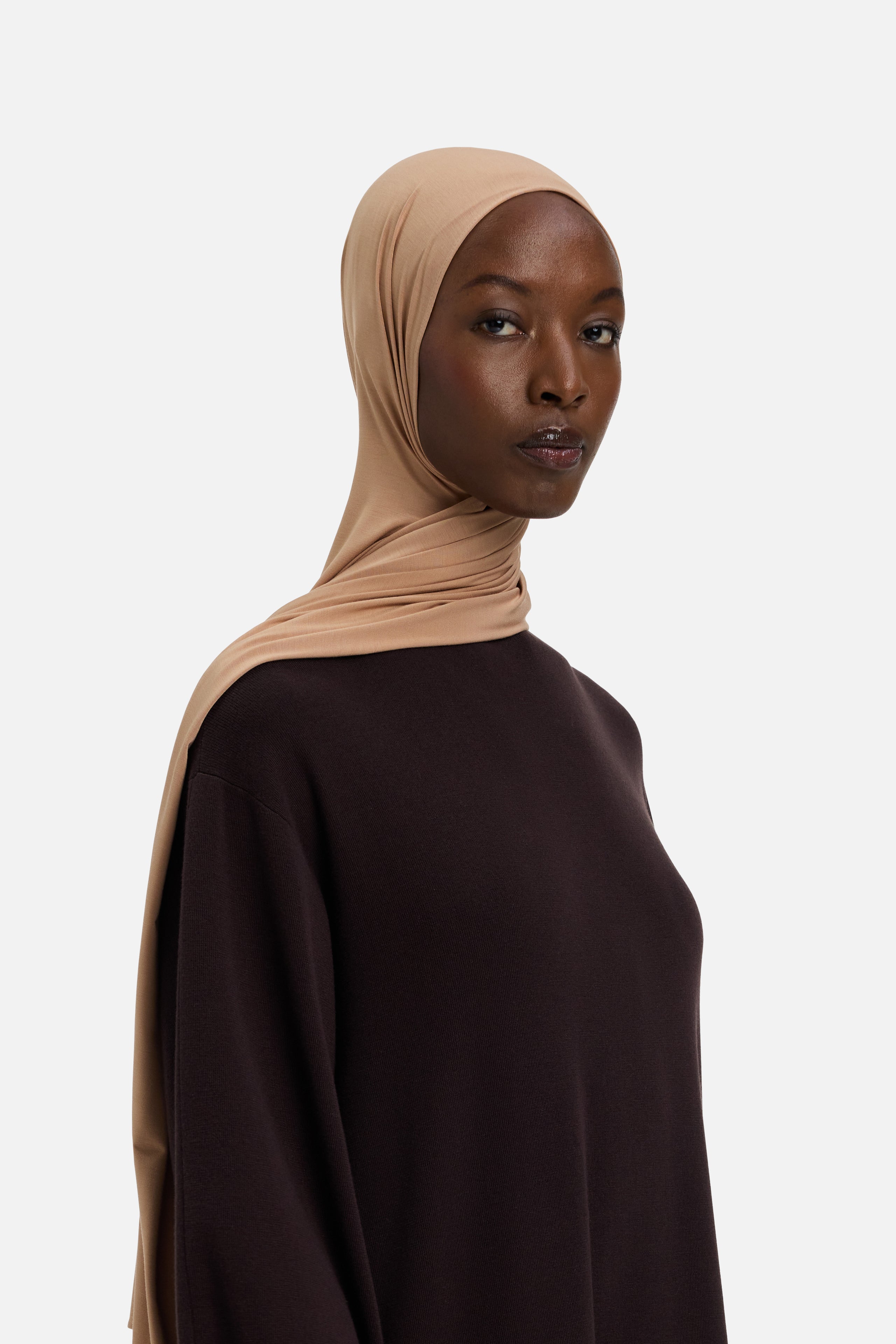 Model wearing beige MERRACHI headscarf, front view
