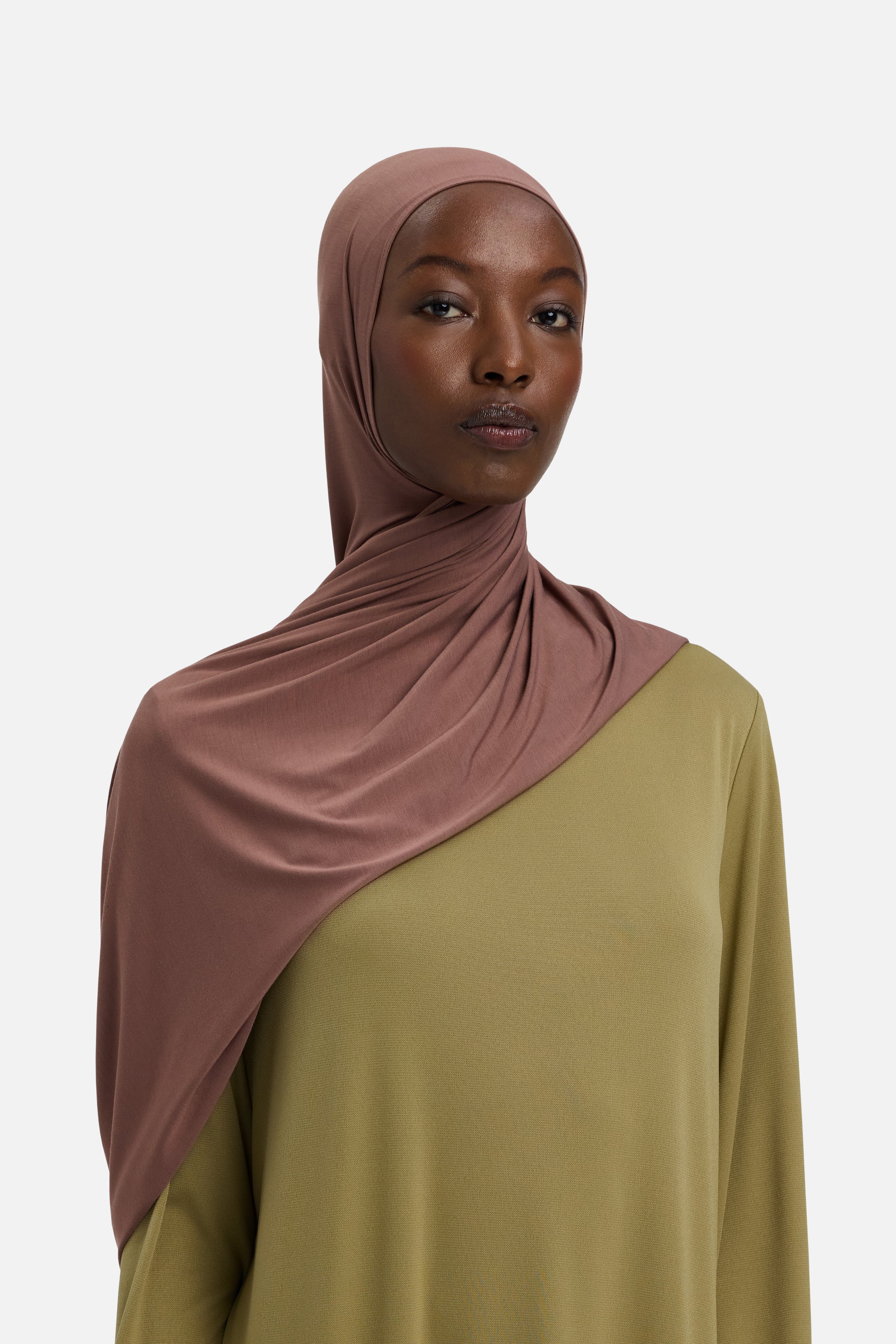 Model wearing red MERRACHI headscarf, front view