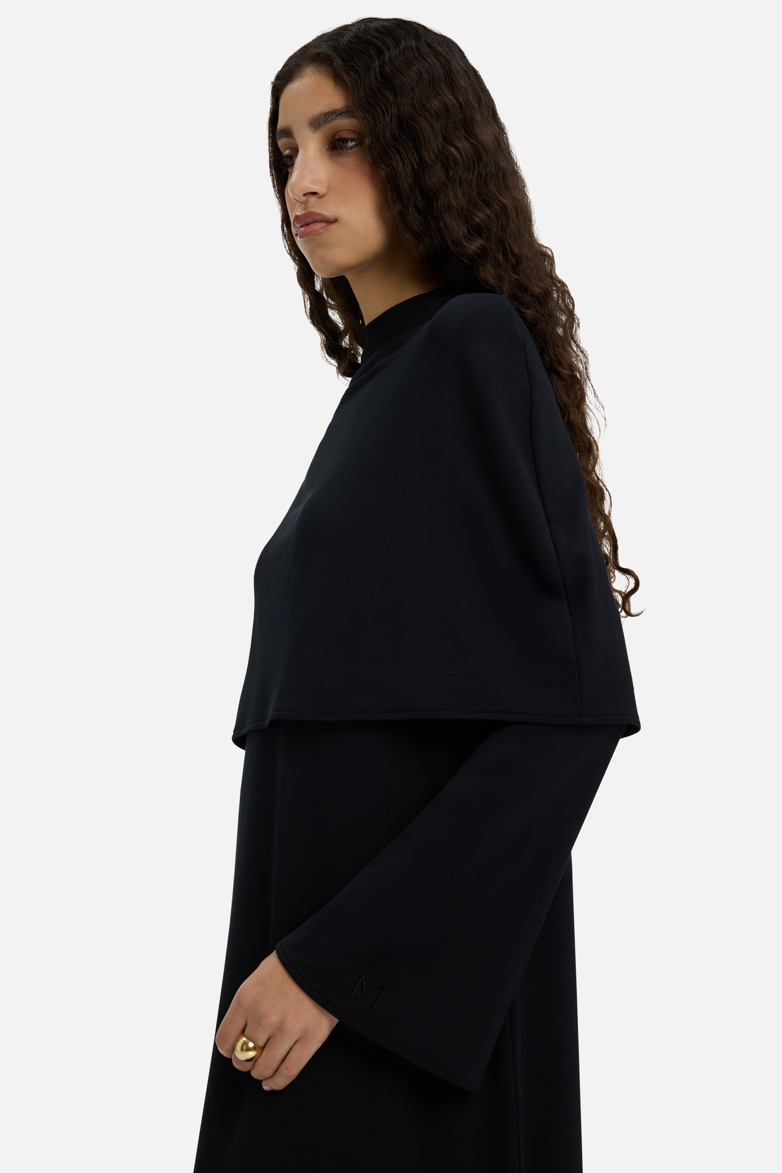 Detail shot model wearing black dress