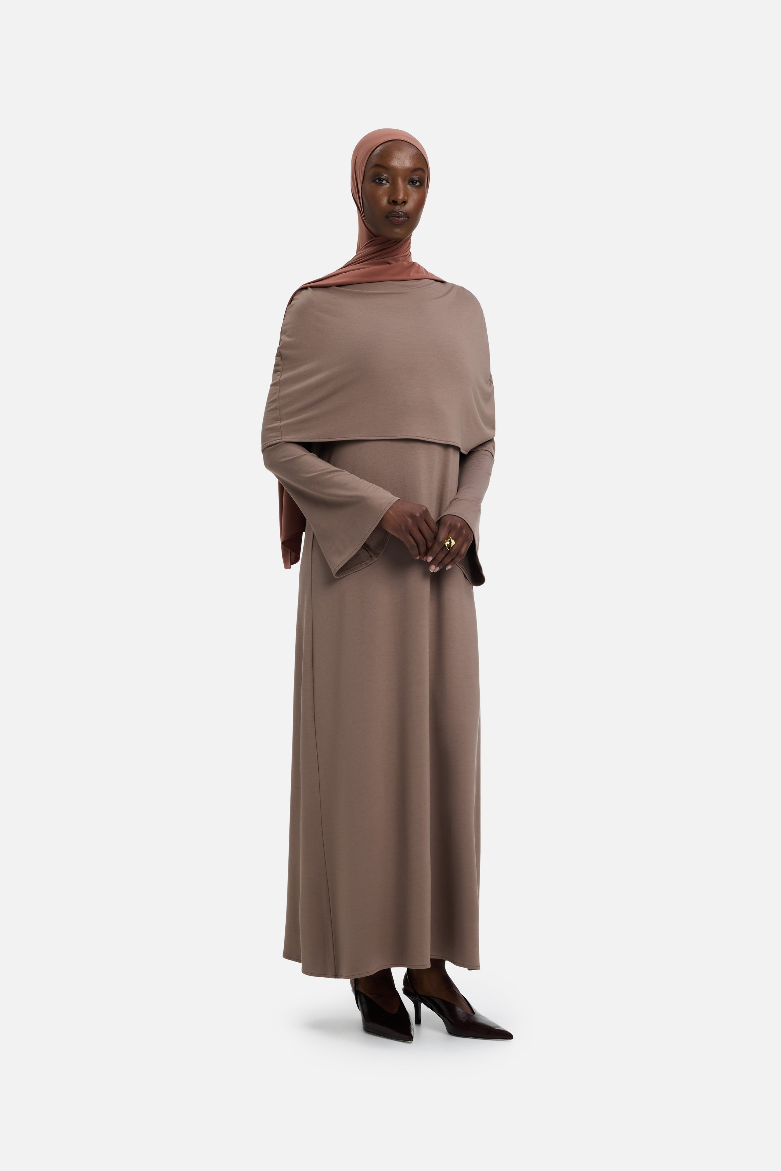 Front view model wearing taupe dress