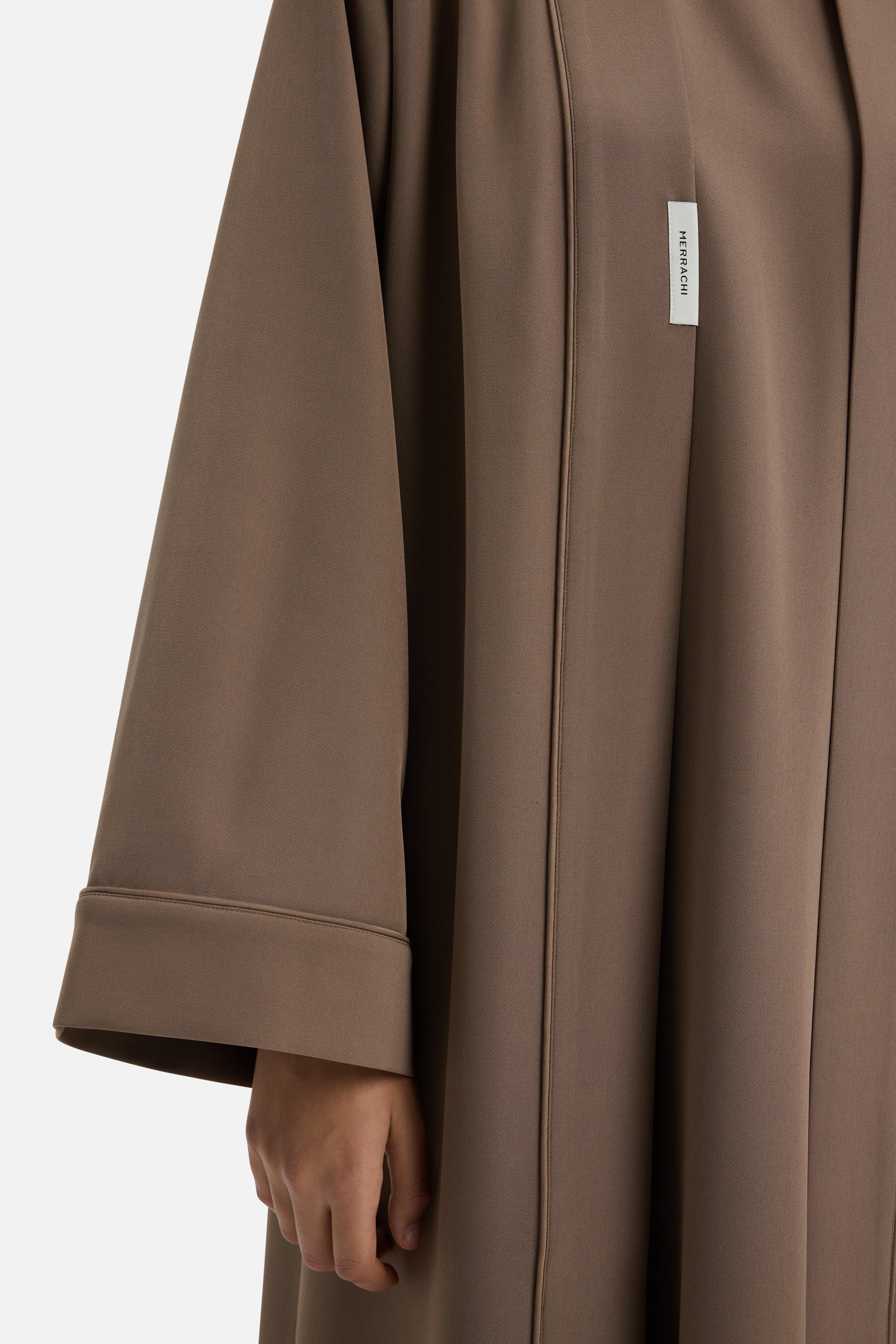Close up view taupe abaya