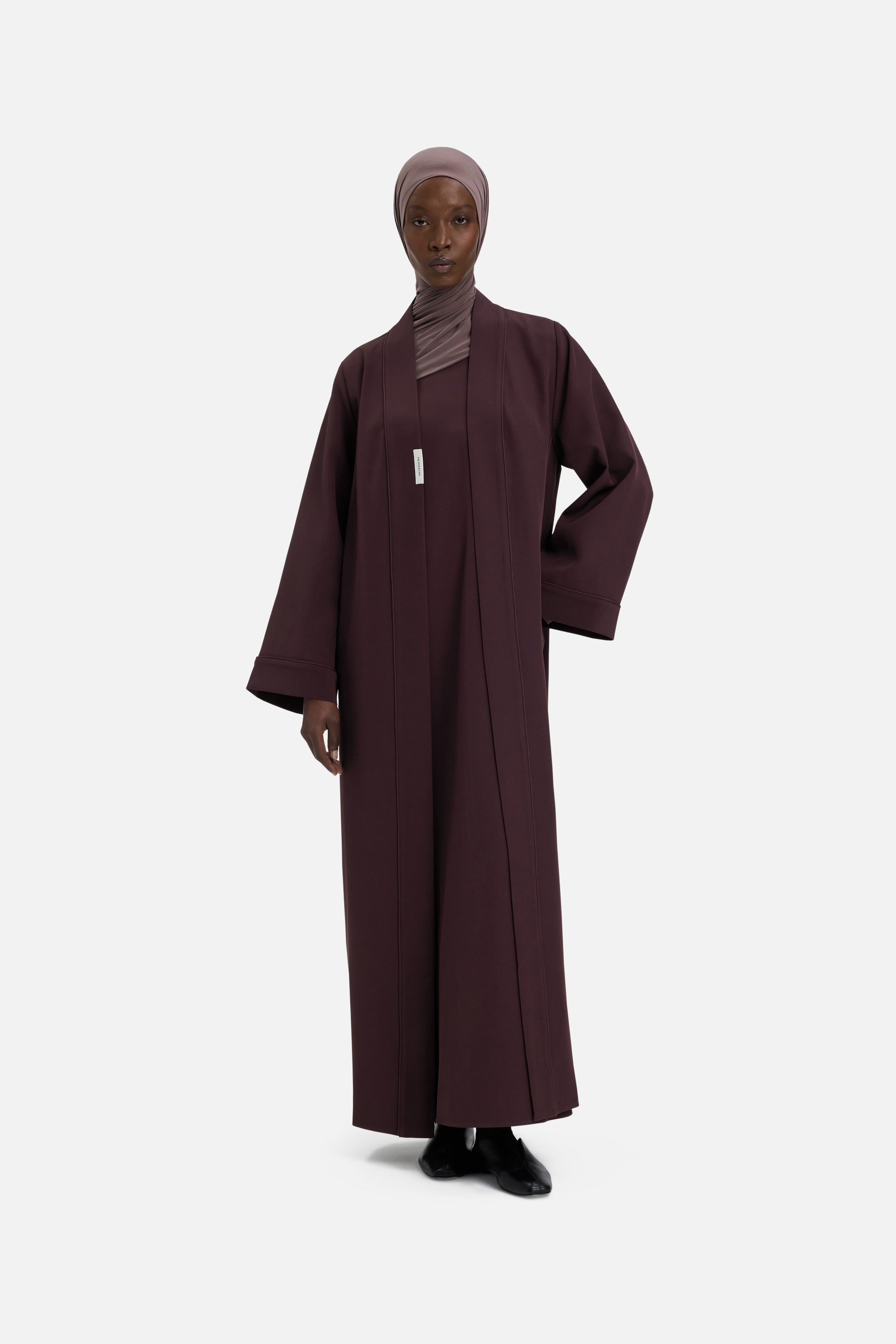 Front view model wearing purple abaya