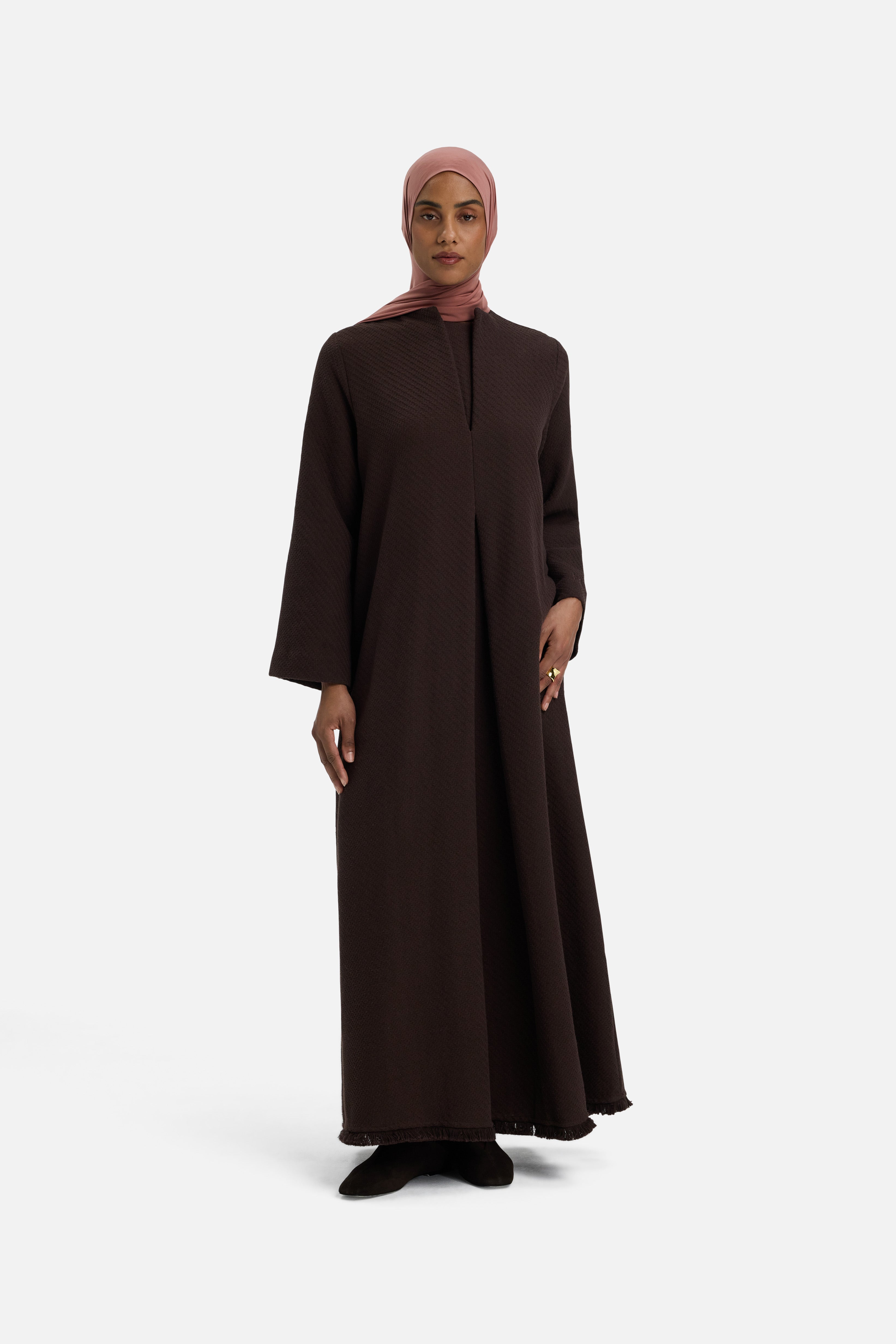 Front view model wearing dark brown dress and pink headscarf
