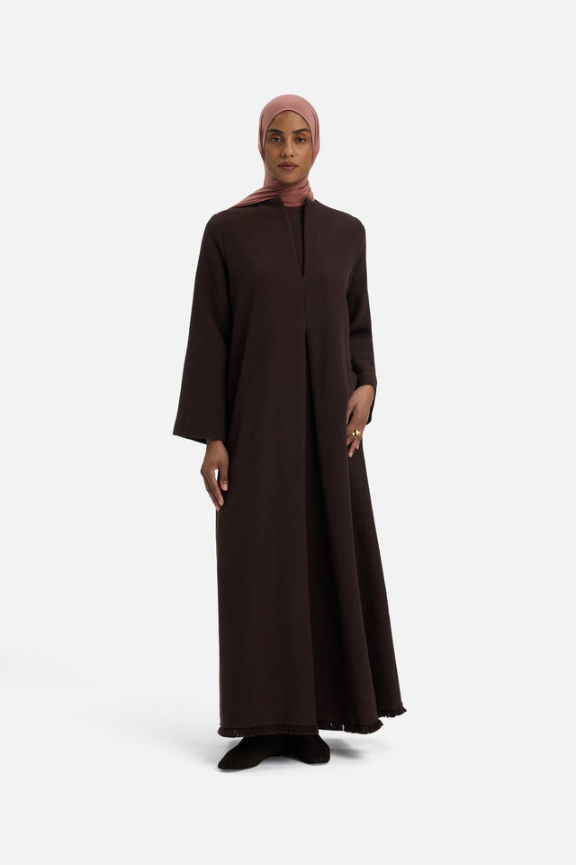 Front view model wearing dark brown dress and pink headscarf