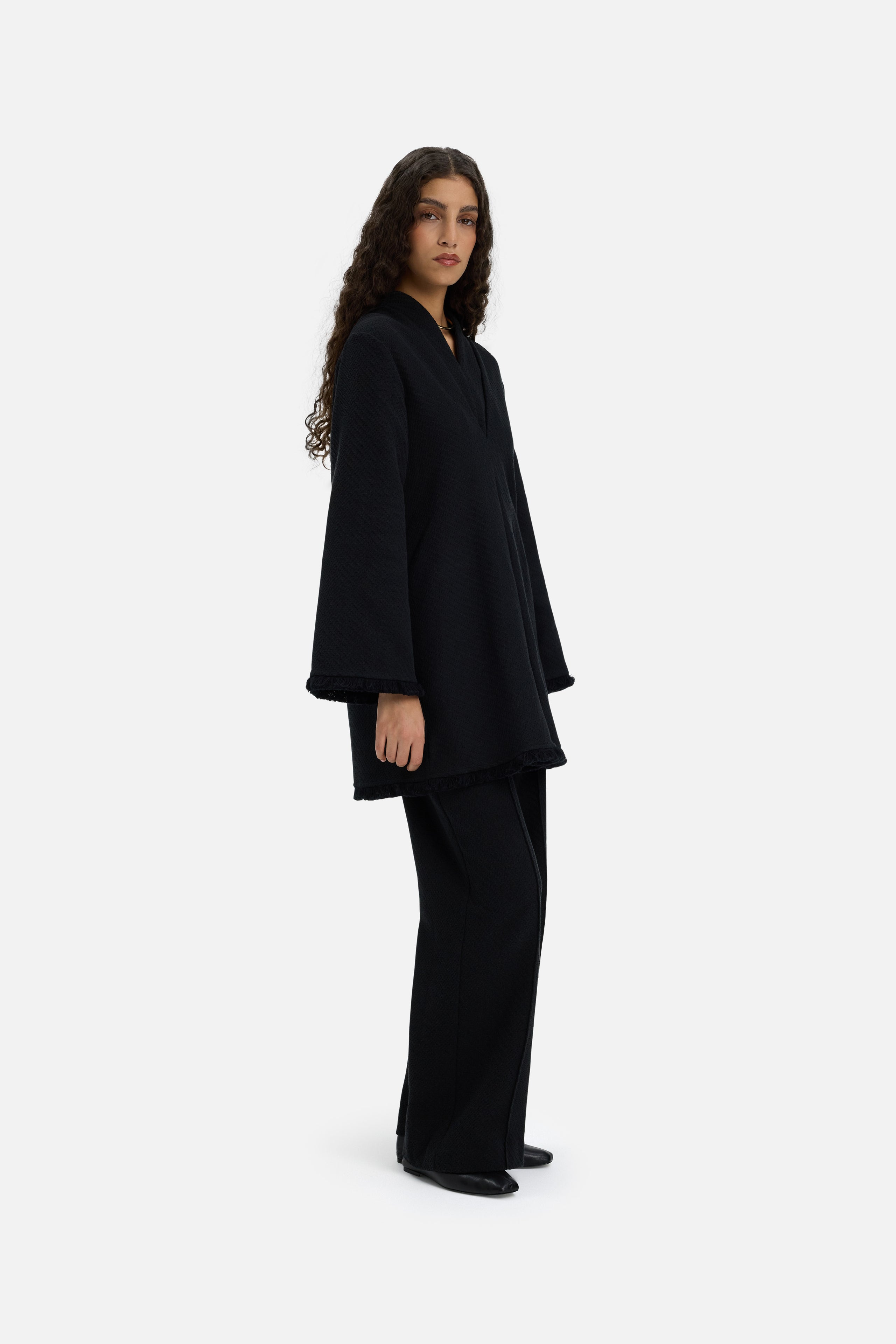 Front view model wearing black trousers