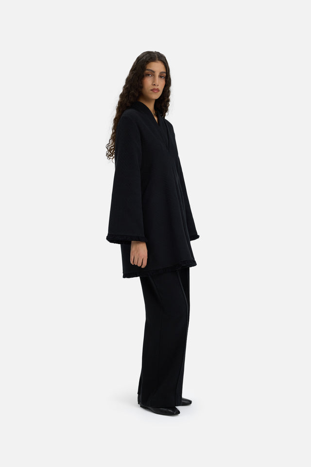 Front view model wearing black trousers