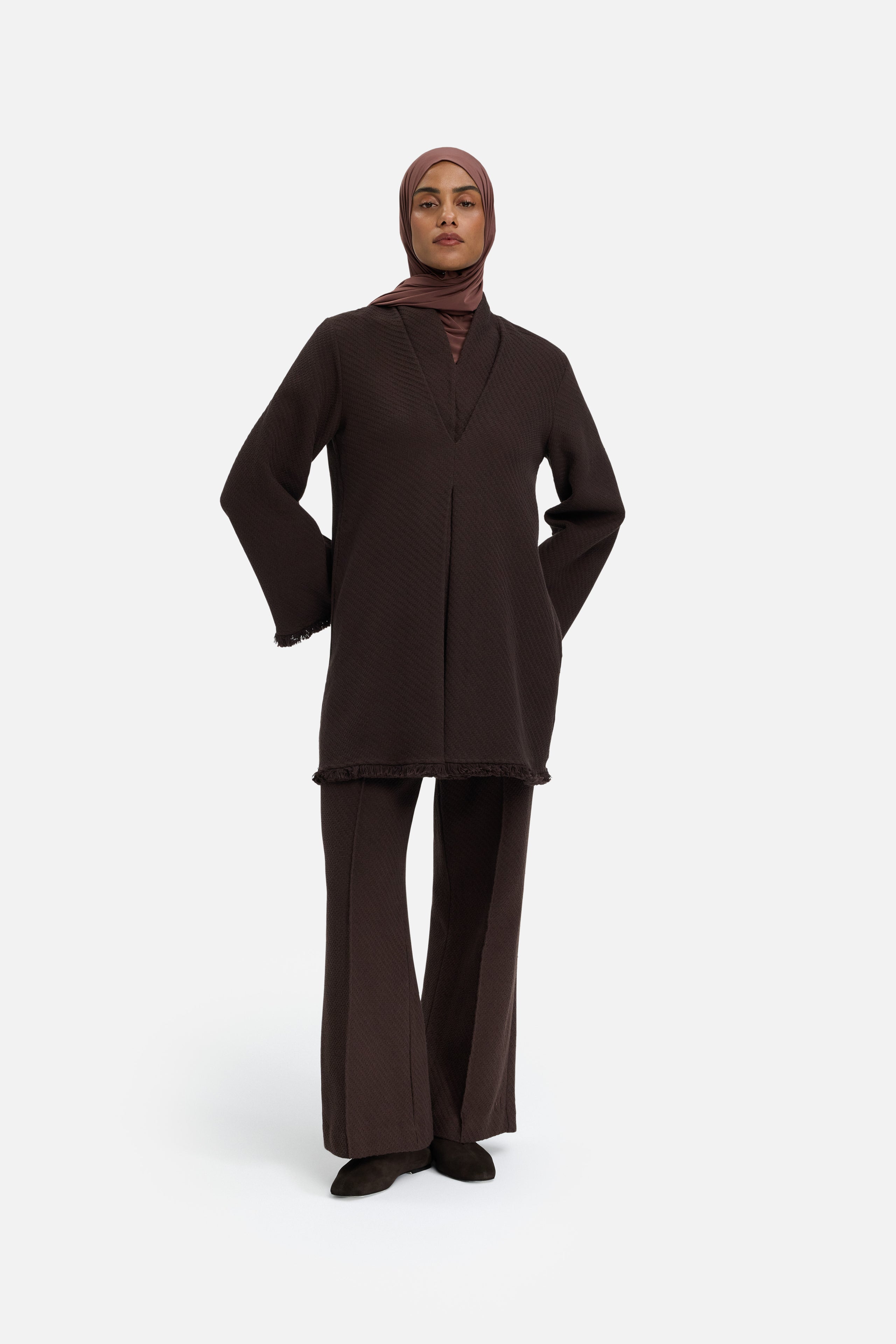 Front view model wearing brown pants and headscarf
