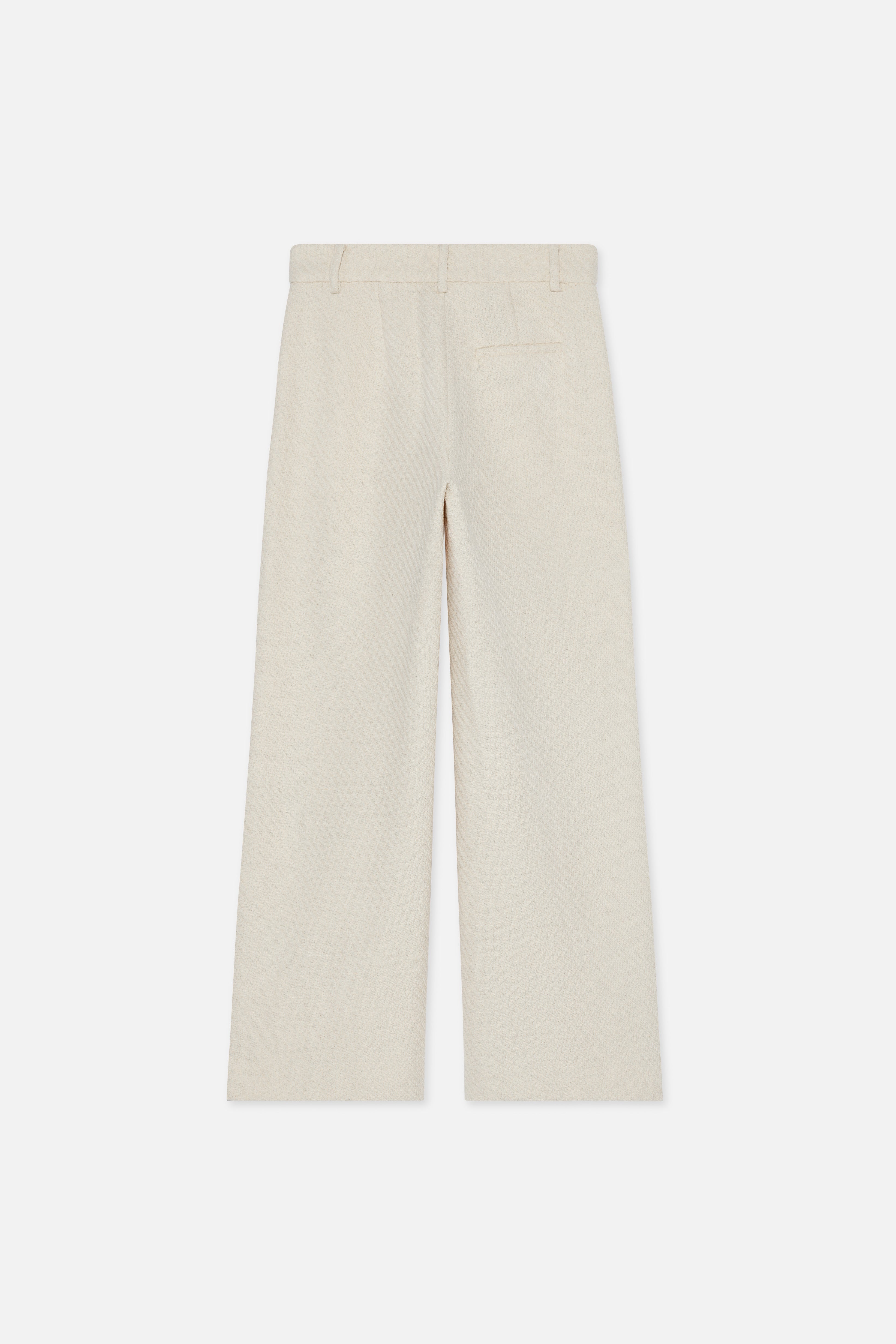 Flat lay back off white trousers