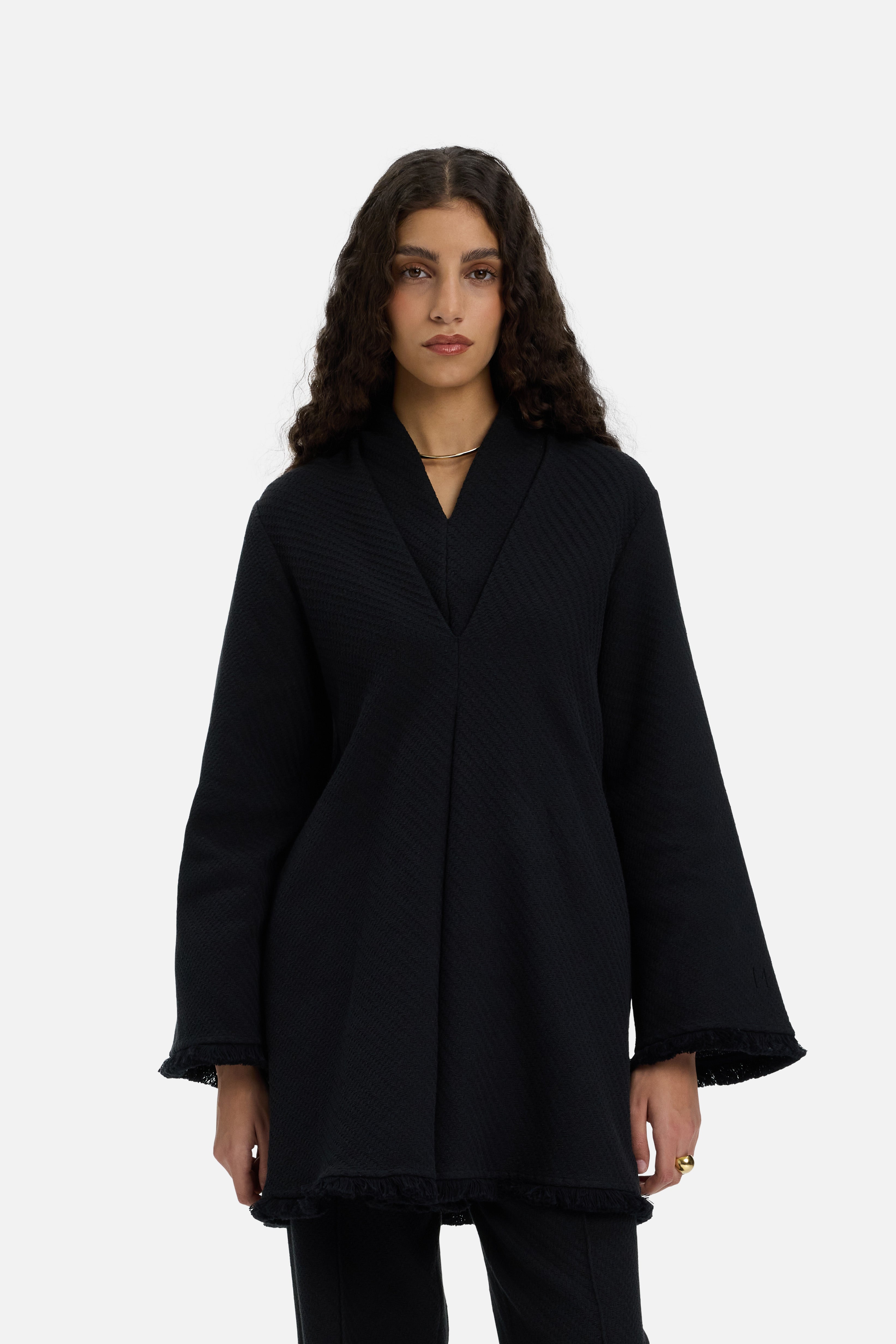 Cropped front view model wearing long black top