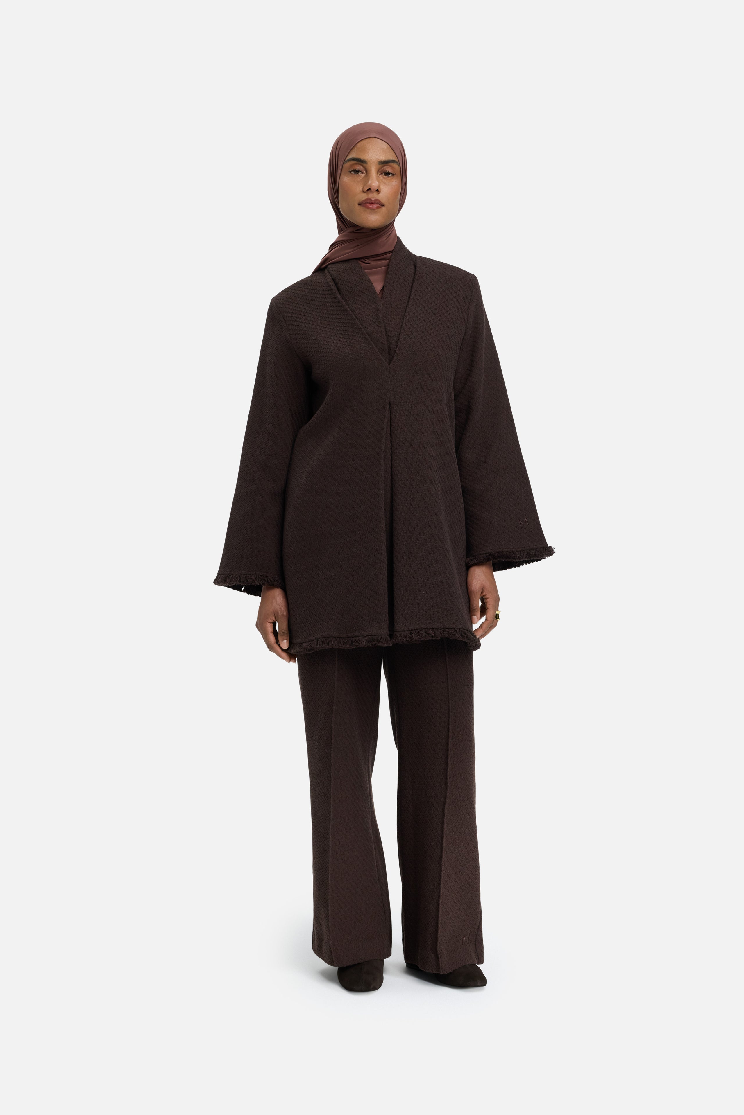 Front view model wearing dark brown top and headscarf