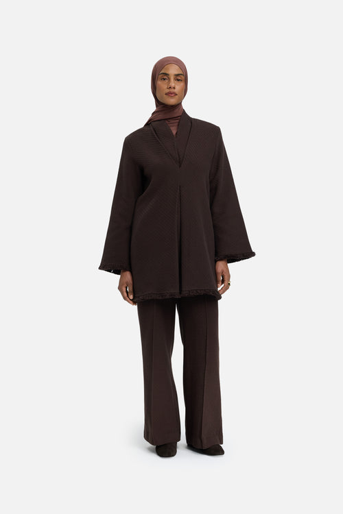 Front view model wearing dark brown top and headscarf