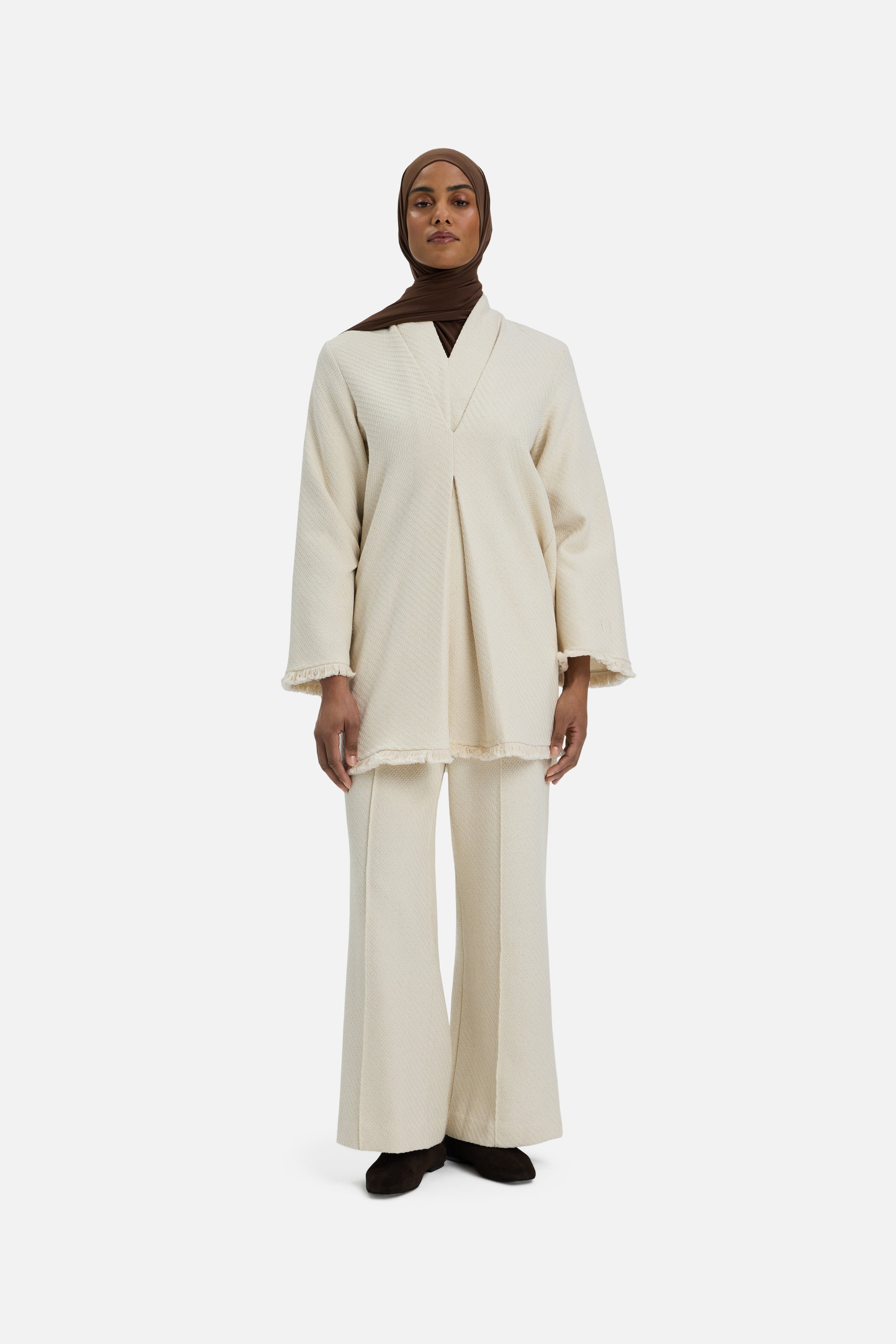 Front view model wearing white top and brown headscarf