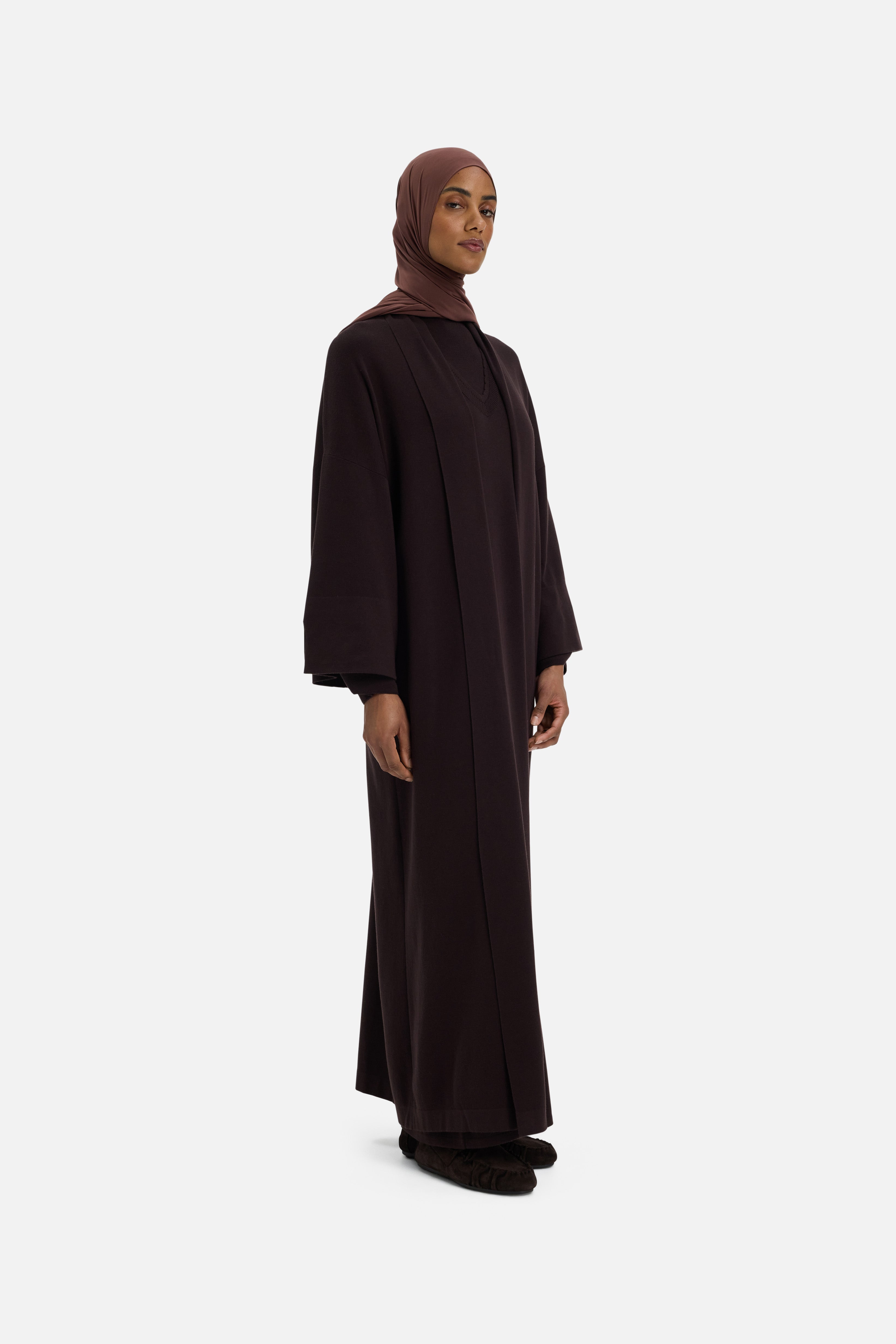 Side view model wearing brown abaya and headscarf