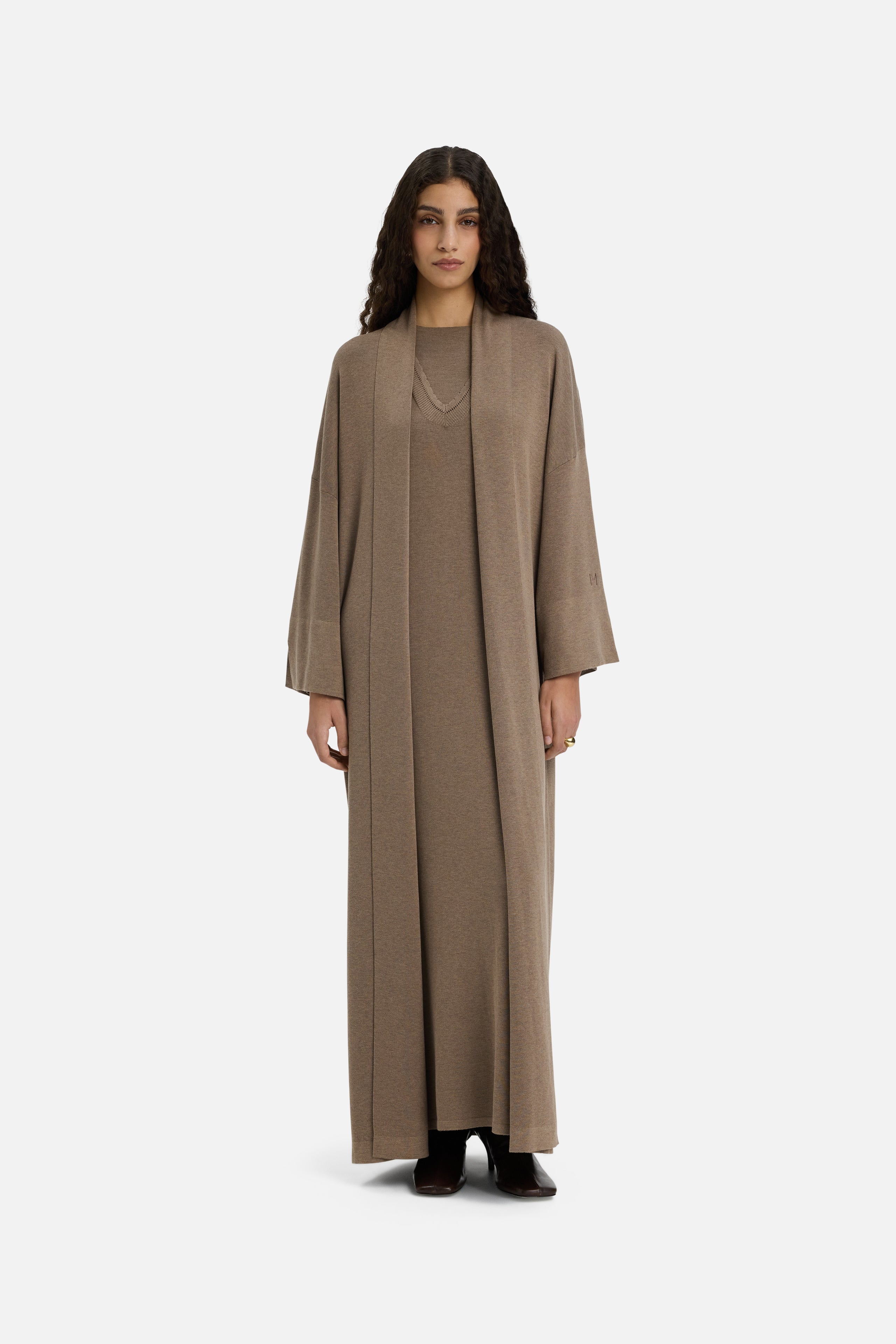 Front view model wearing brown knitted abaya