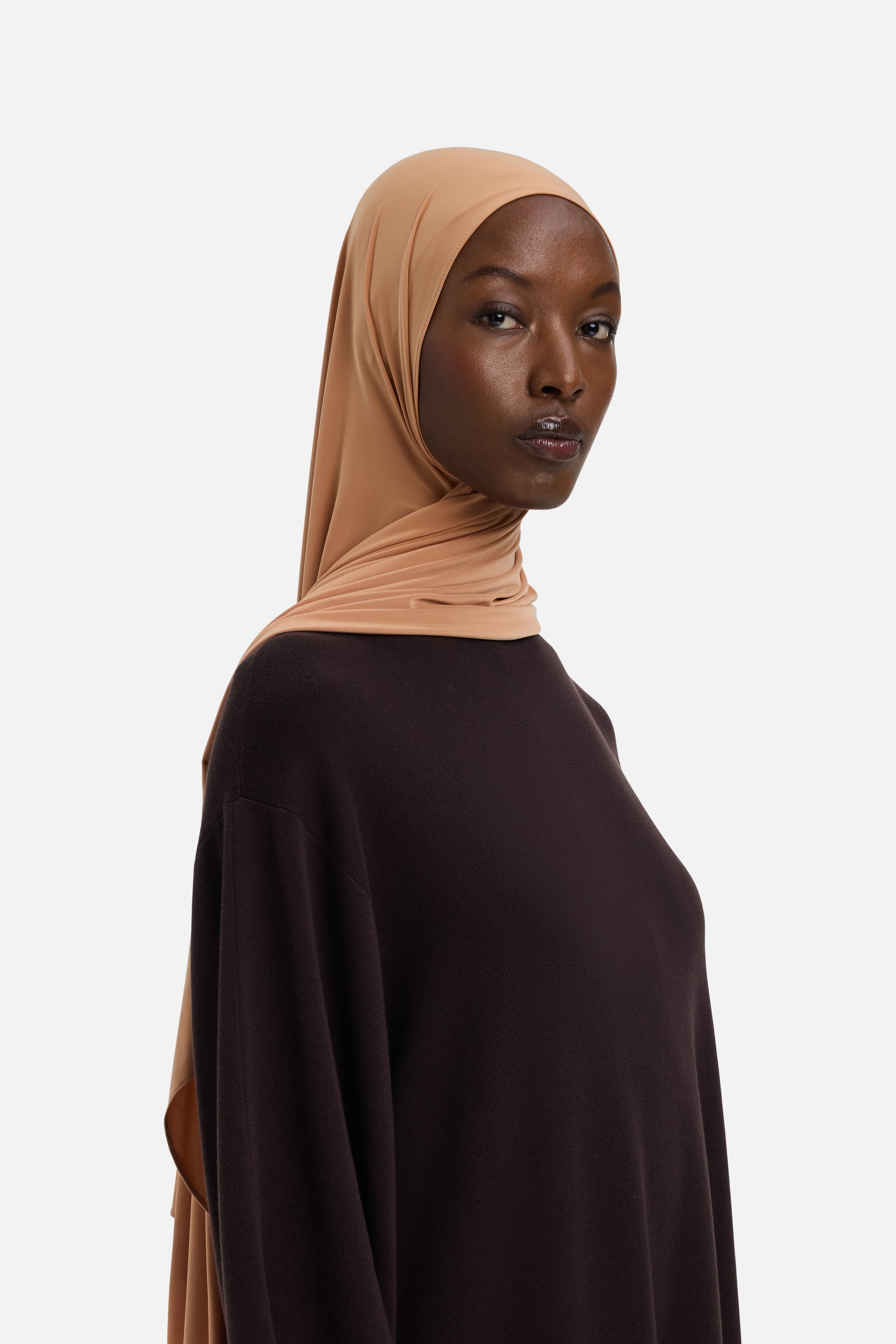 Model wearing orange MERRACHI headscarf, front view