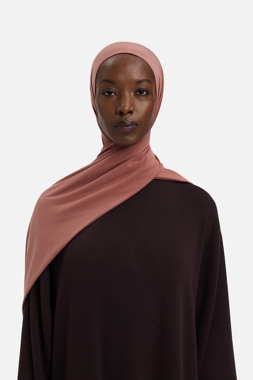 Model wearing pink MERRACHI headscarf, front view
