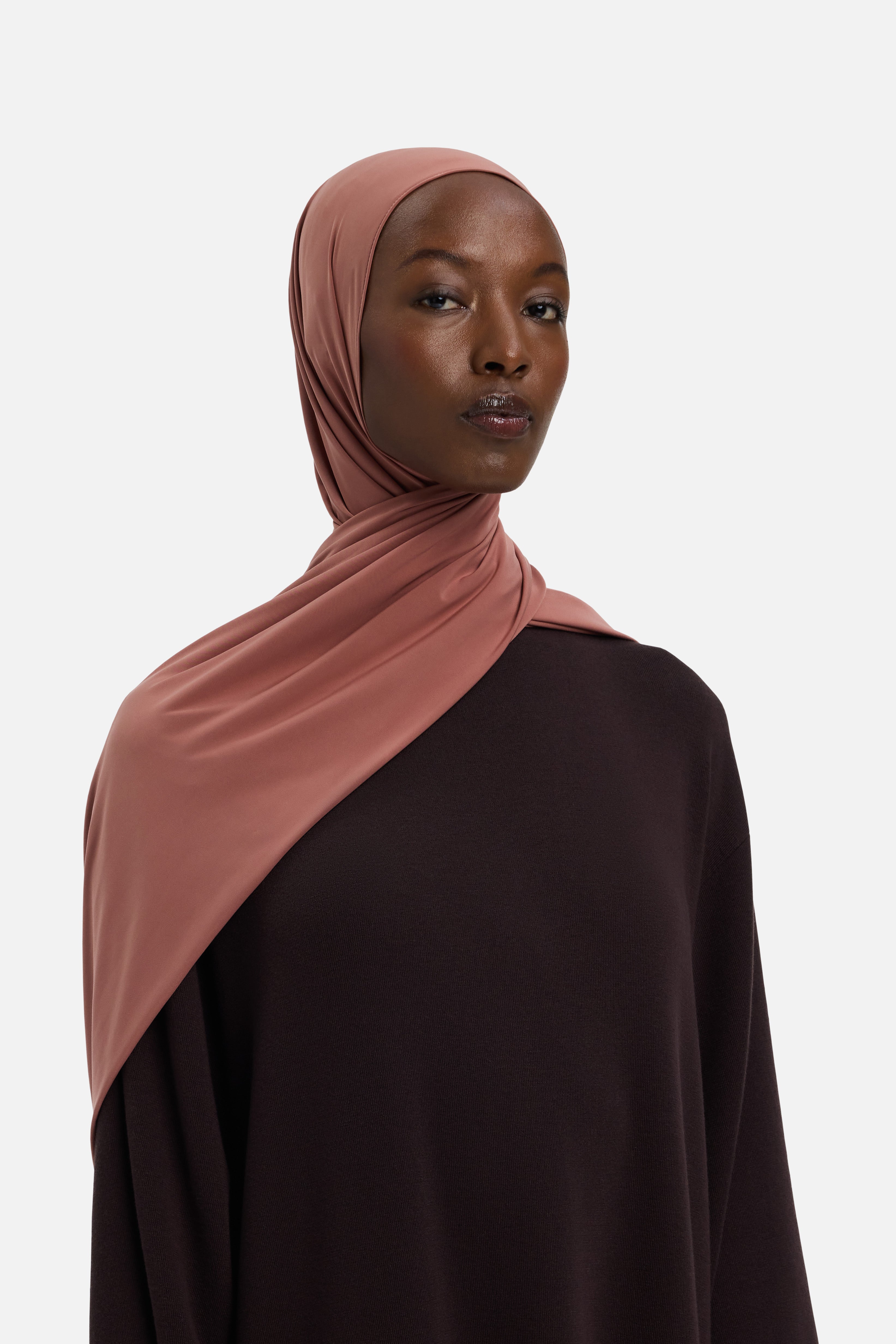 Model wearing pink MERRACHI headscarf, side view