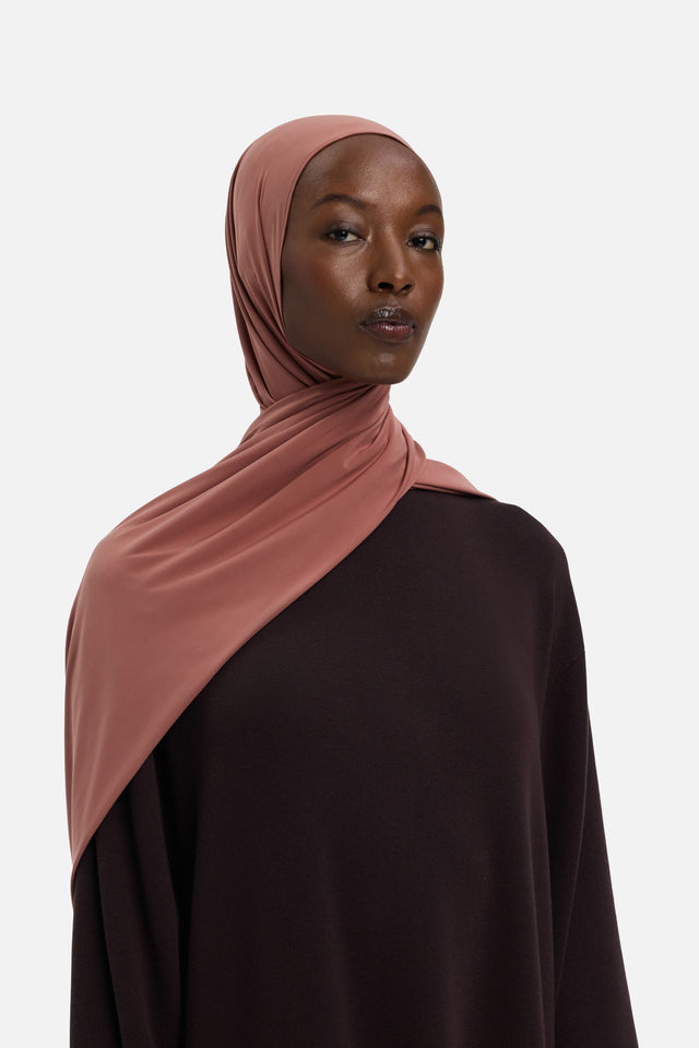 Model wearing pink MERRACHI headscarf, front view