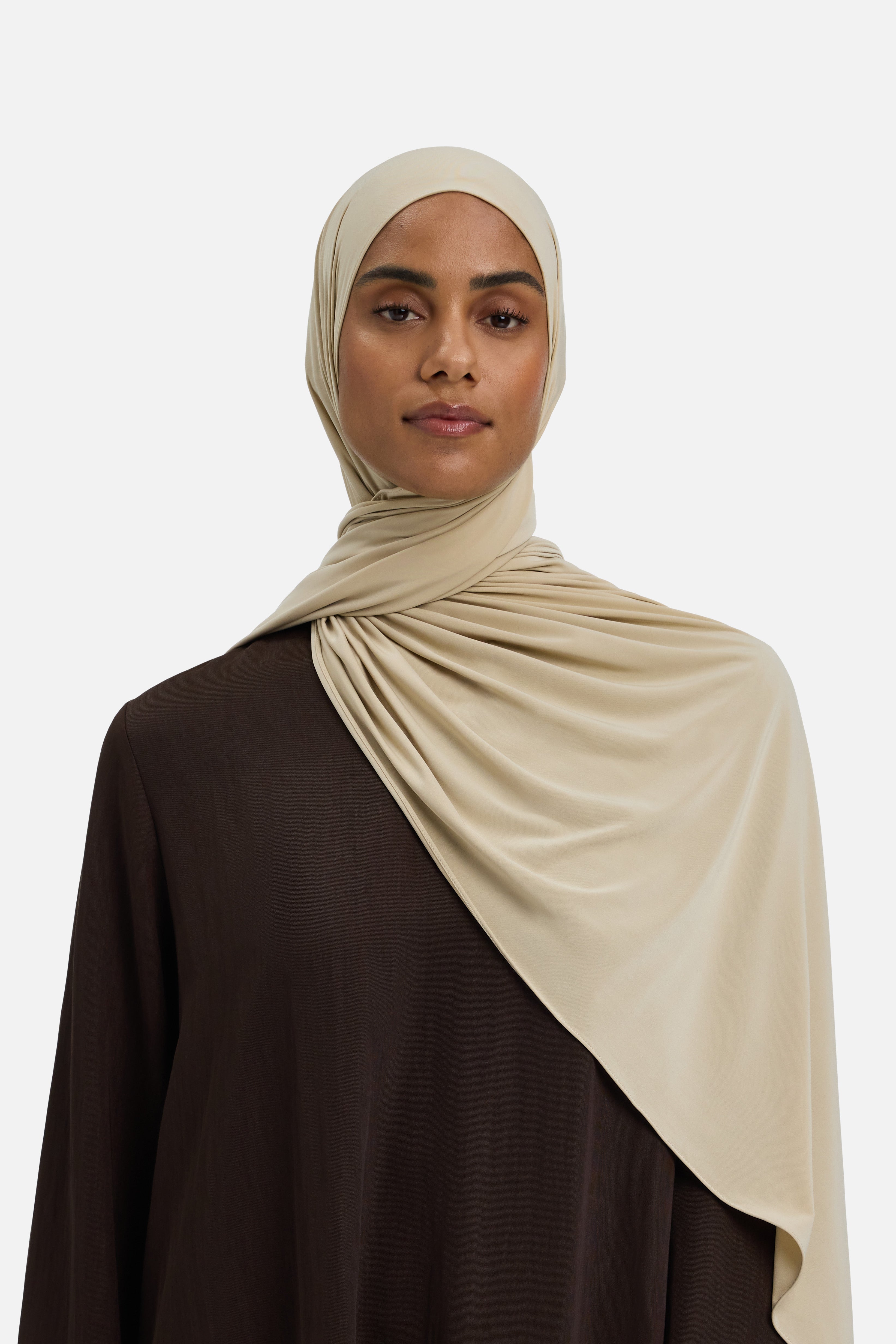 Model wearing beige MERRACHI headscarf, front view