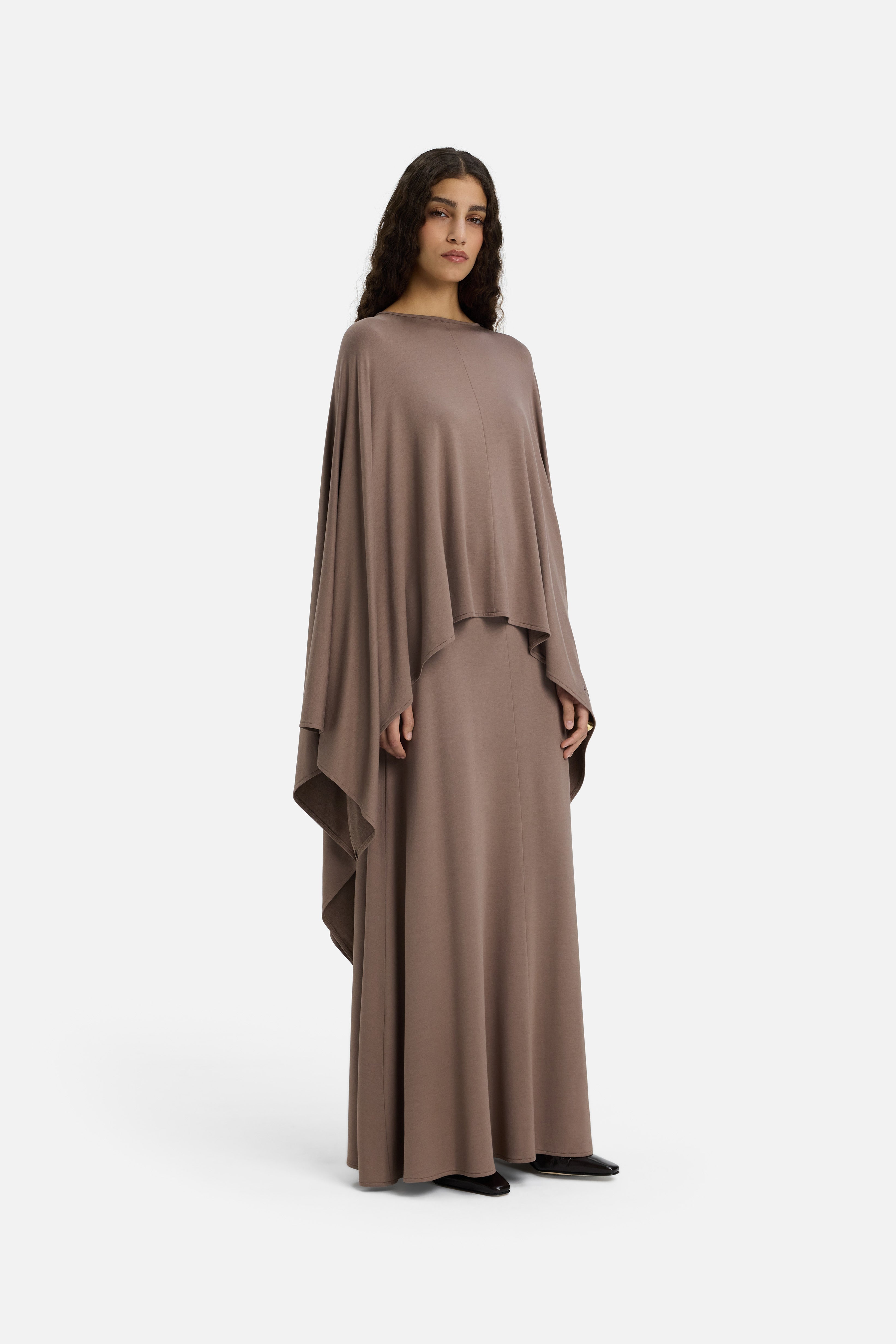 Model wearing taupe MERRACHI cape, side view