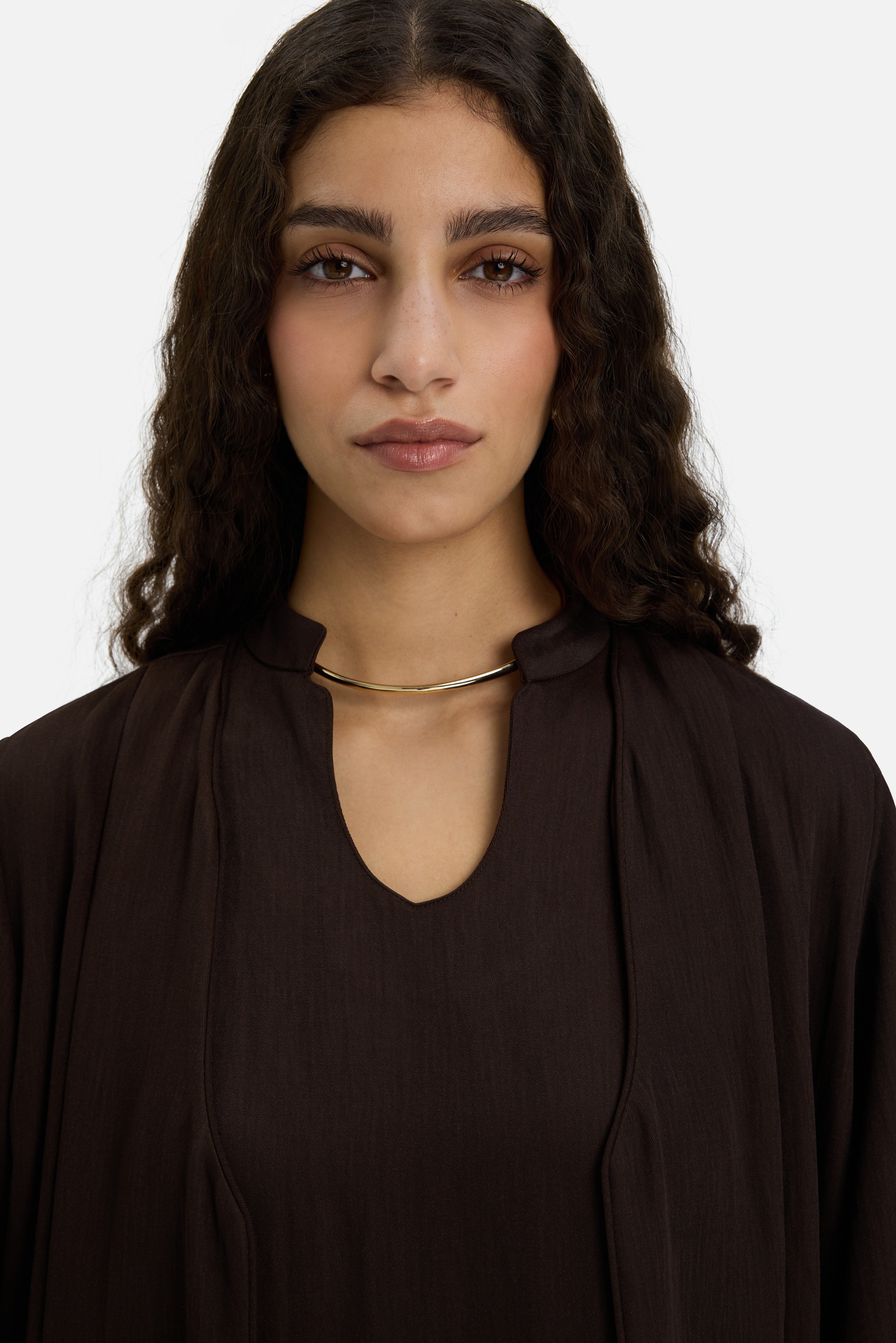Close up model wearing dark brown abaya