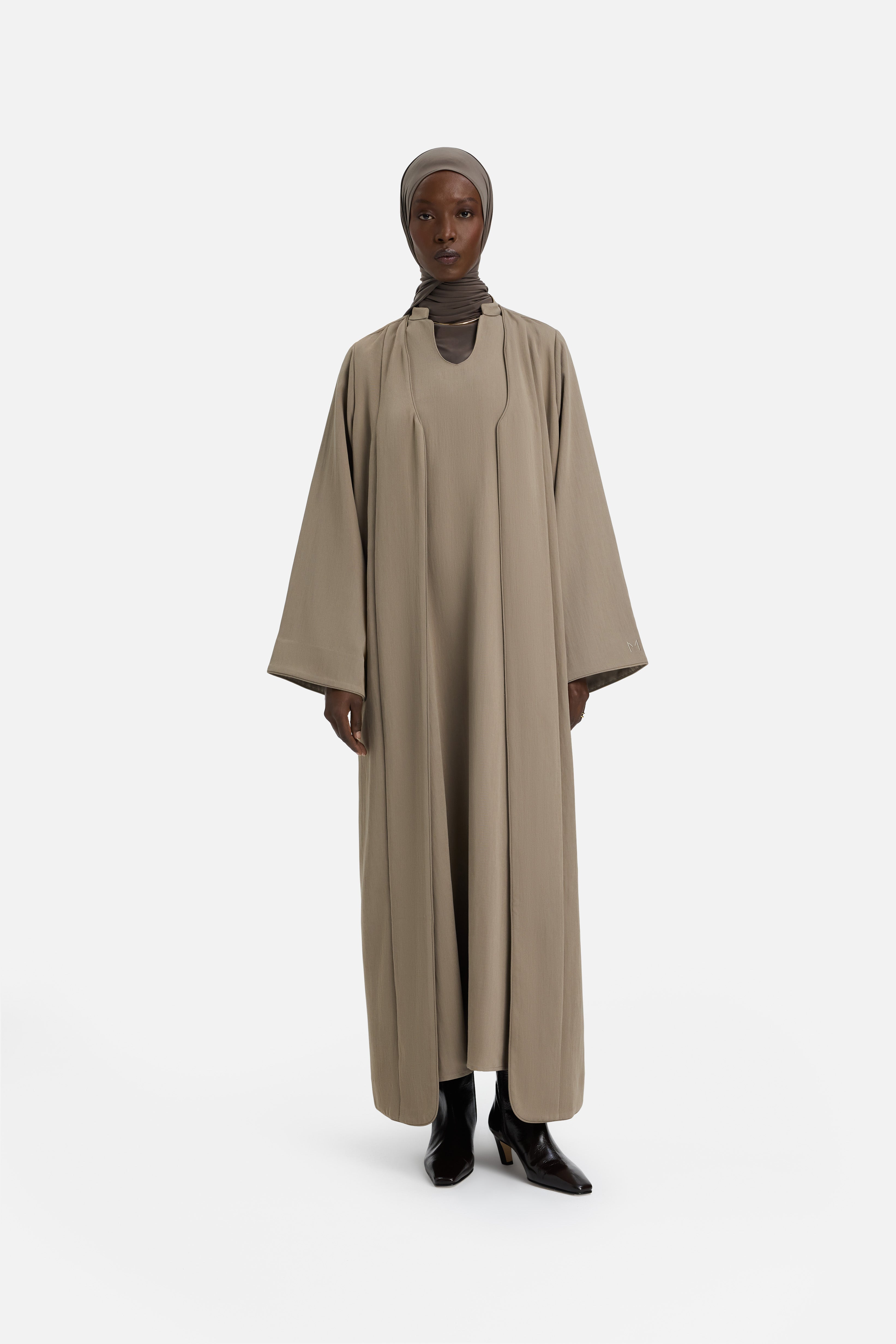 Front view model wearing khaki abaya and grey headscarf