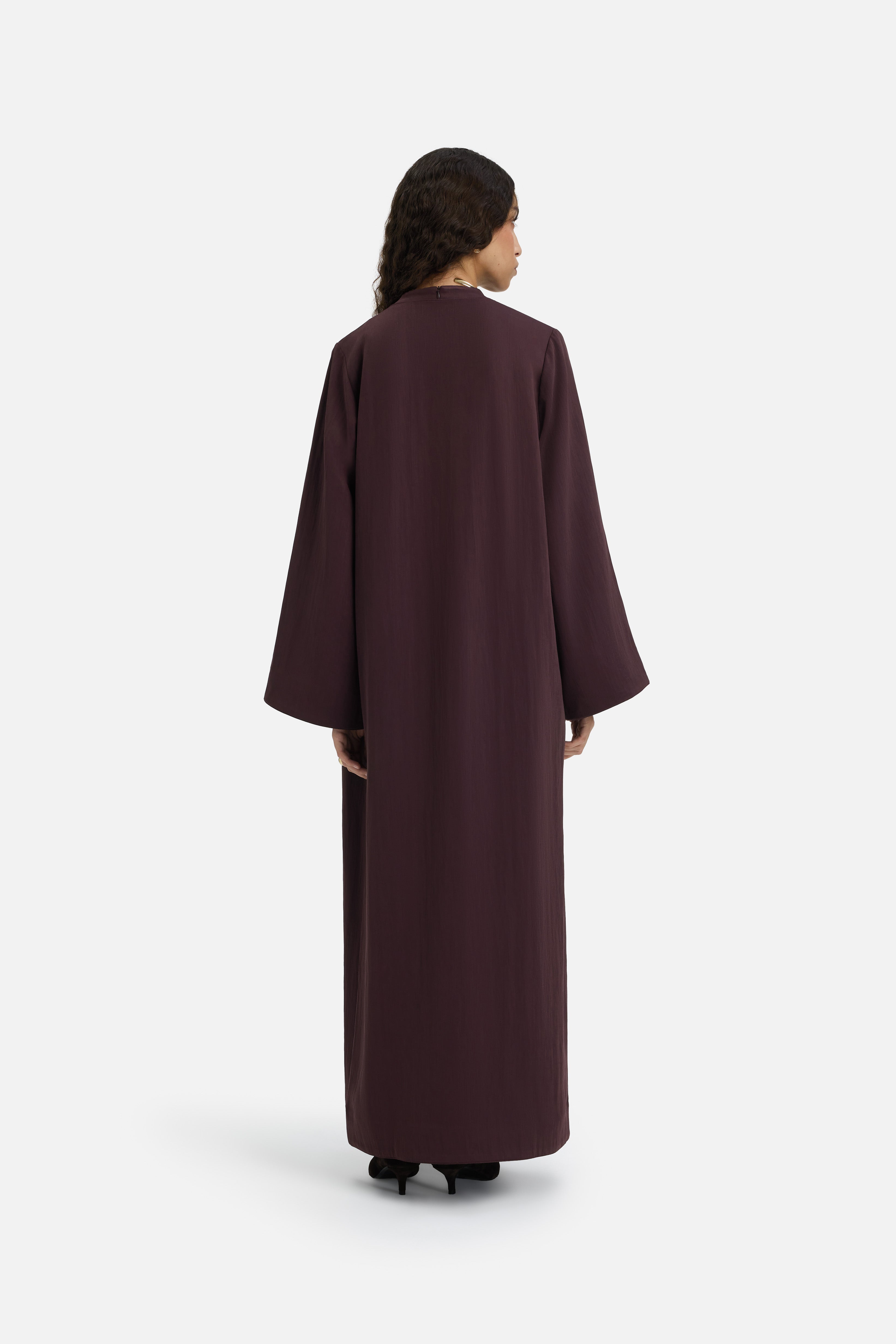 Back view model wearing purple abaya