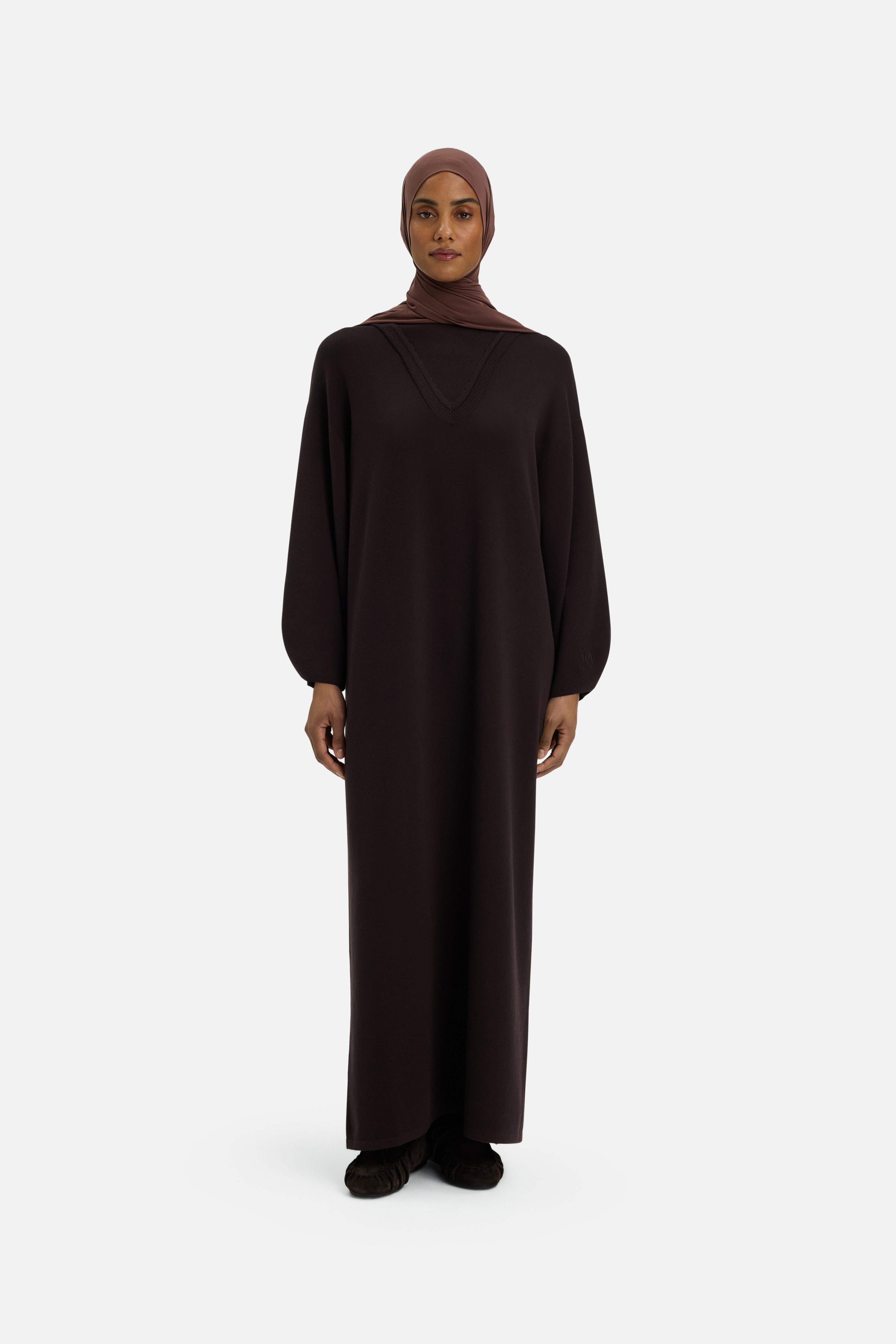 Front view model wearing long brown dress and headscarf