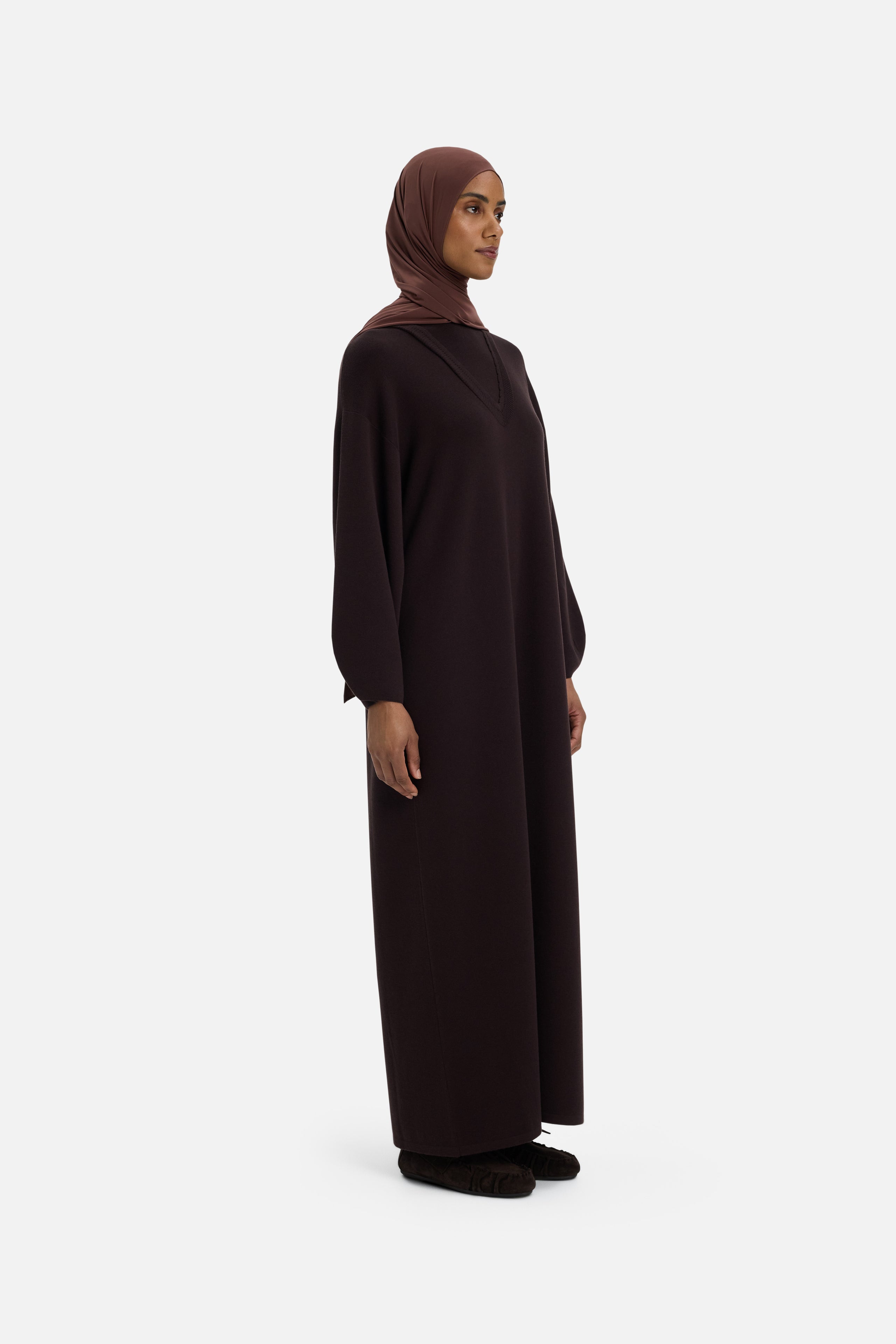 Front view model wearing long brown dress and headscarf