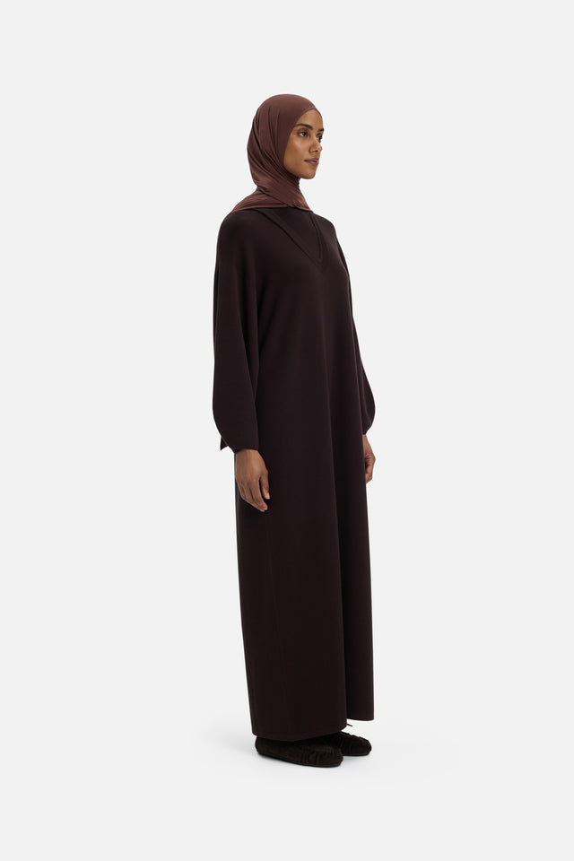 Front view model wearing long brown dress and headscarf