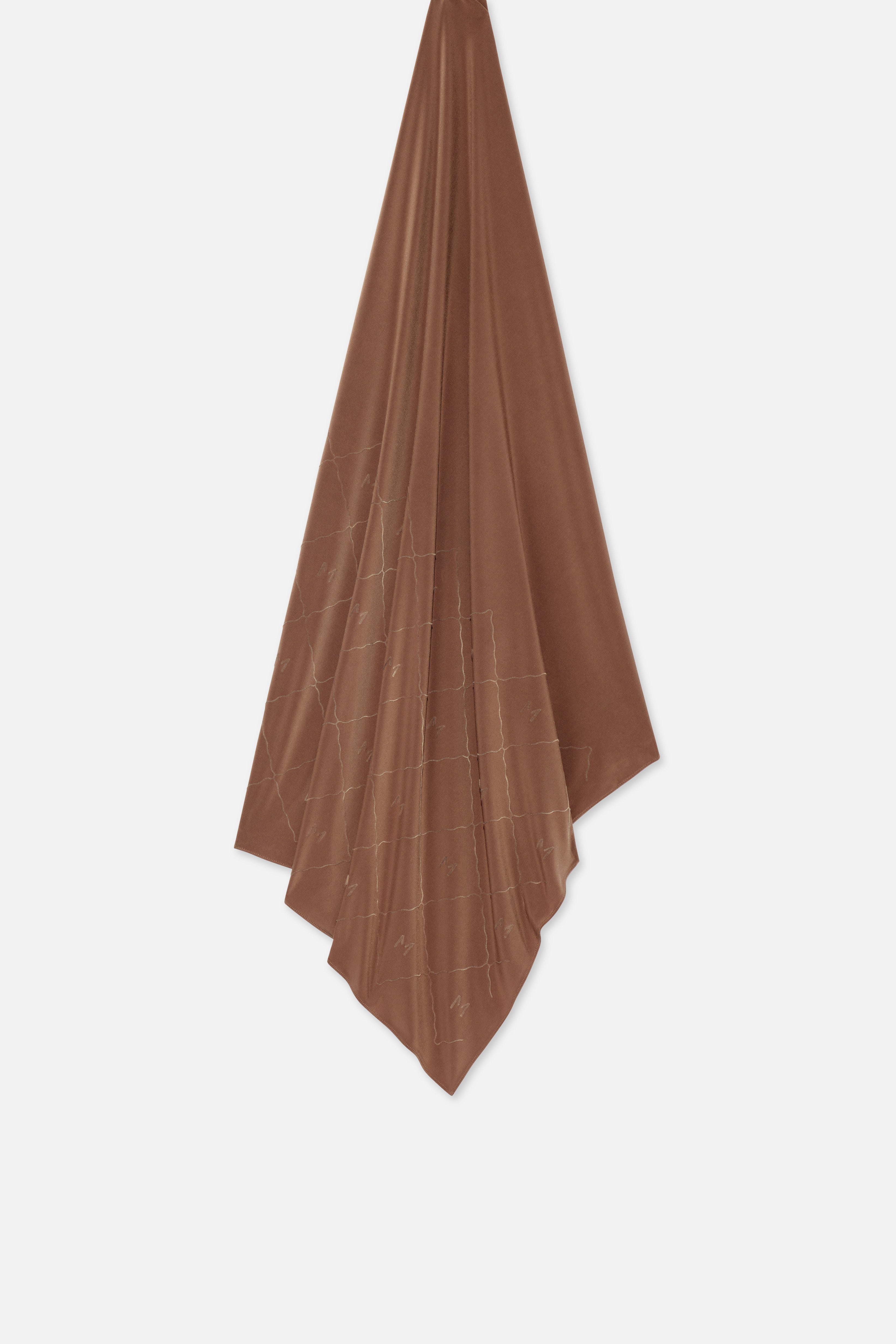 Flat lay brown headscarf with MERRACHI logo and embroidery